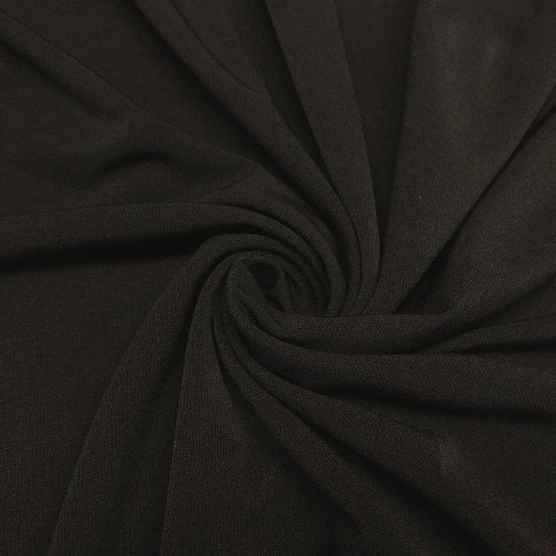 1/2 YD ITY Knit fabric in Black, showcasing its soft texture and stretchability, ideal for various sewing projects.