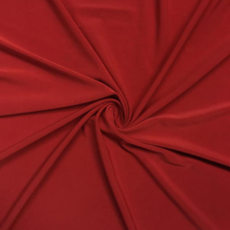 1/2 yard of vibrant red ITY knit fabric, showcasing its soft and stretchy texture, ideal for various sewing projects.