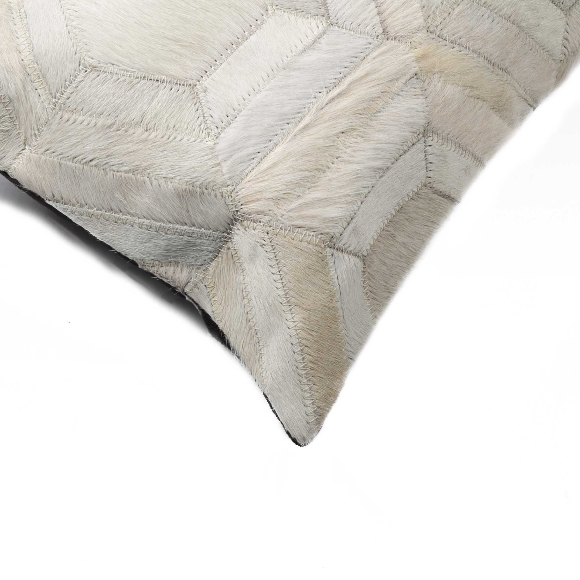 A luxurious gray pillow made from premium Indian cowhide, featuring a soft microsuede backing and concealed zipper closure.