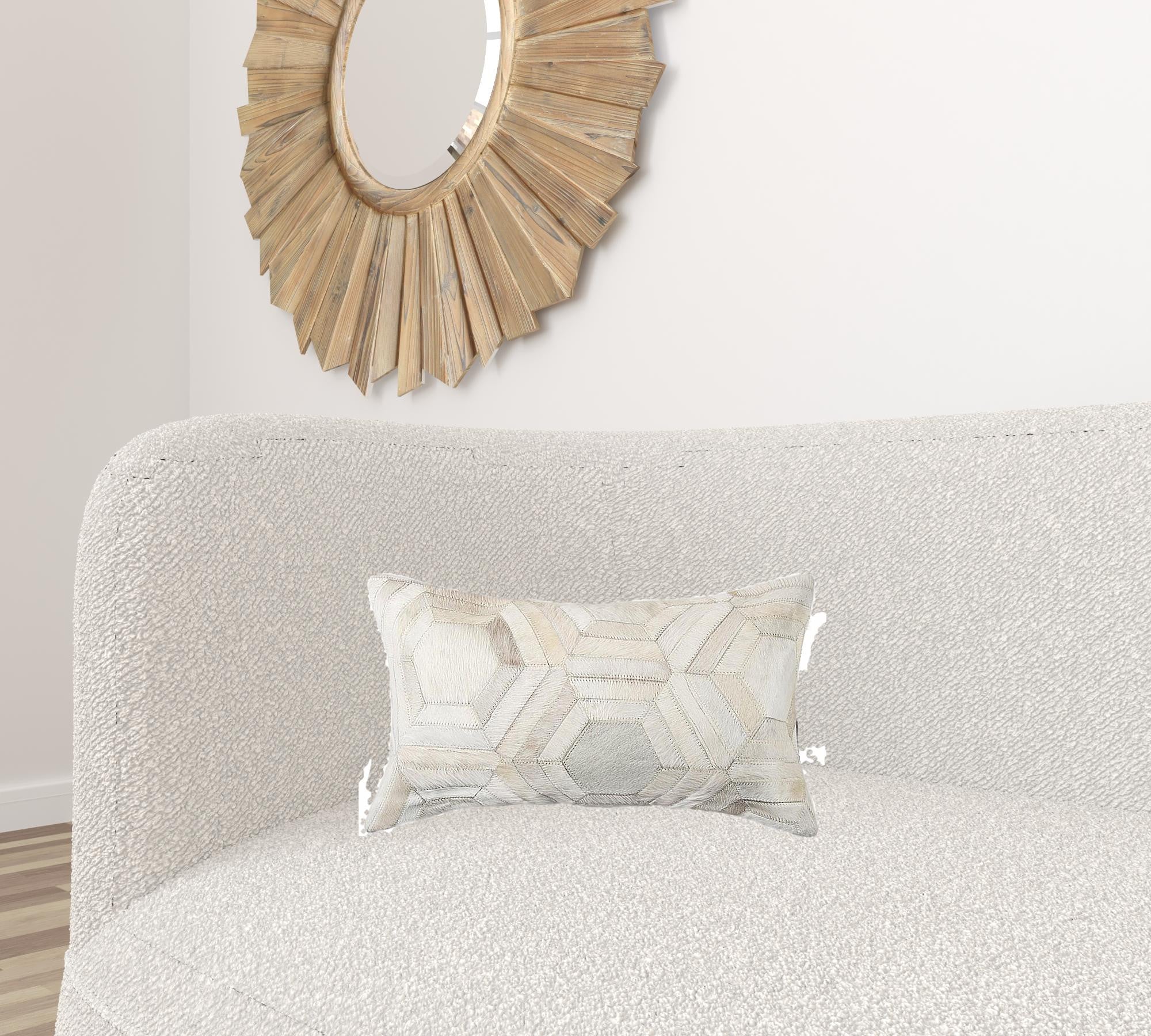 A luxurious gray pillow made from premium Indian cowhide, featuring a soft microsuede backing and concealed zipper closure.