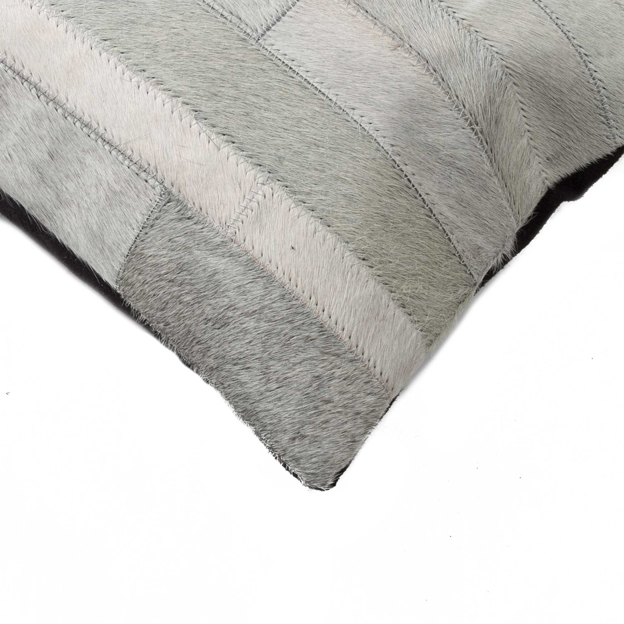 A luxurious gray pillow made from premium Indian cowhide, featuring a soft microsuede backing and concealed zipper closure.