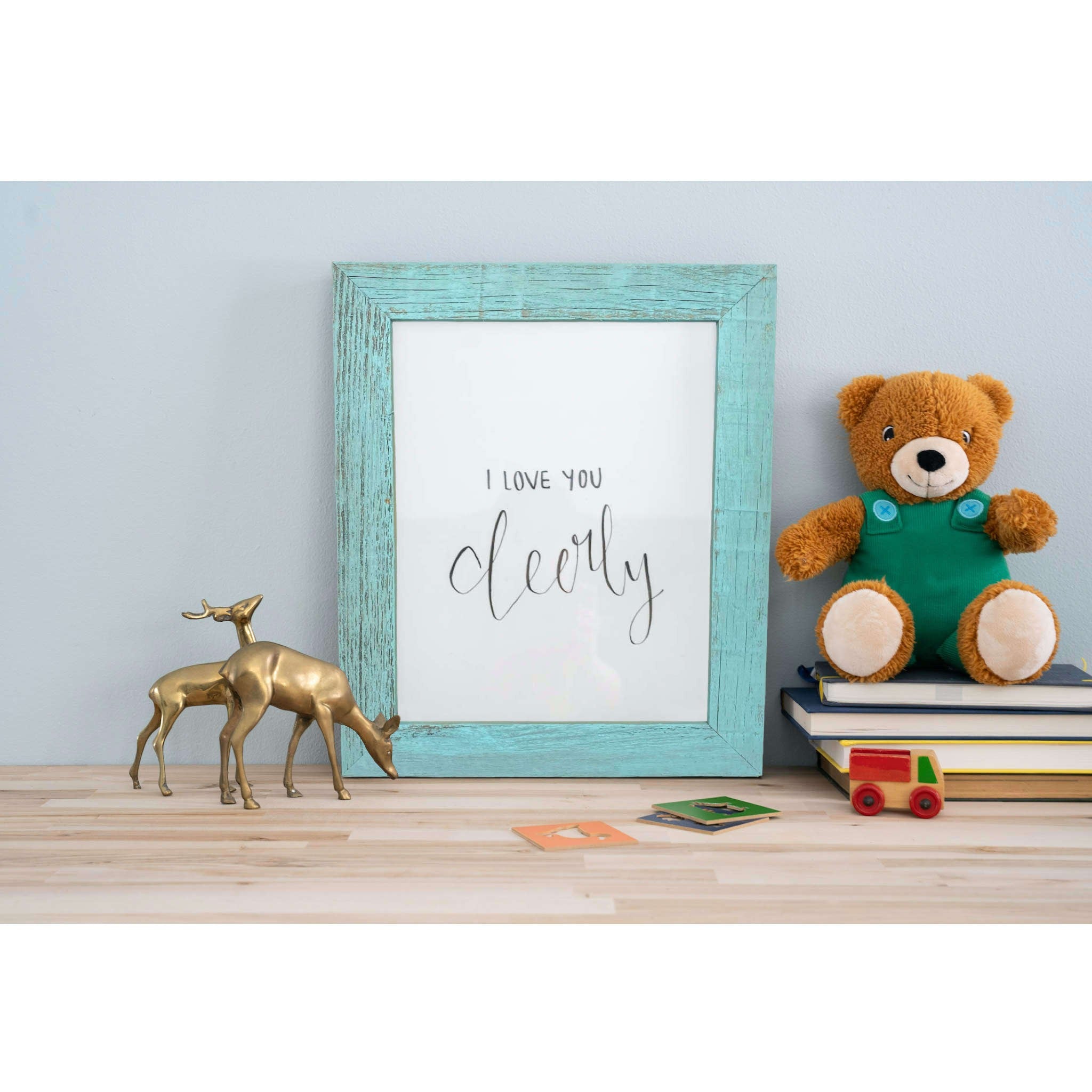 A rustic farmhouse light aqua blue wood frame, 13x19 inches, showcasing a unique distressed finish and plexiglass cover.