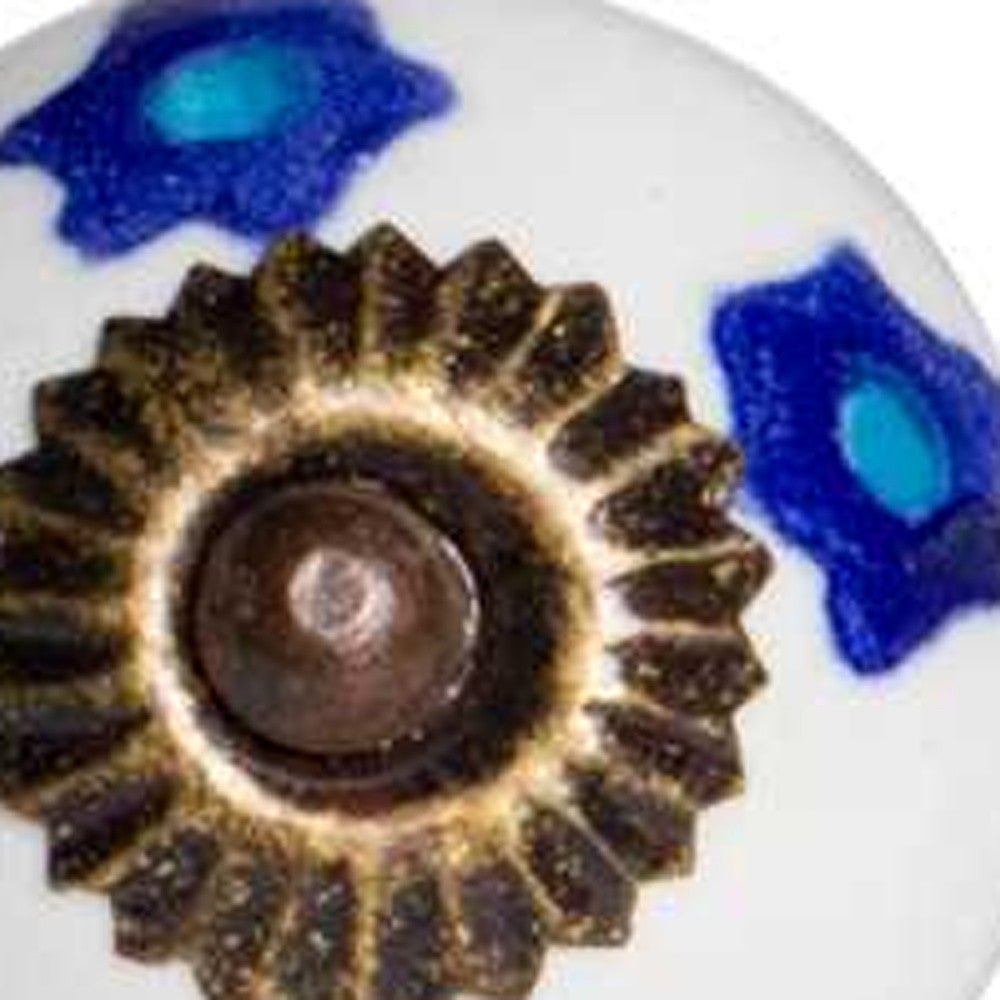 A set of 12 hand-painted ceramic knobs in white, blue, and turquoise, designed for furniture enhancement.