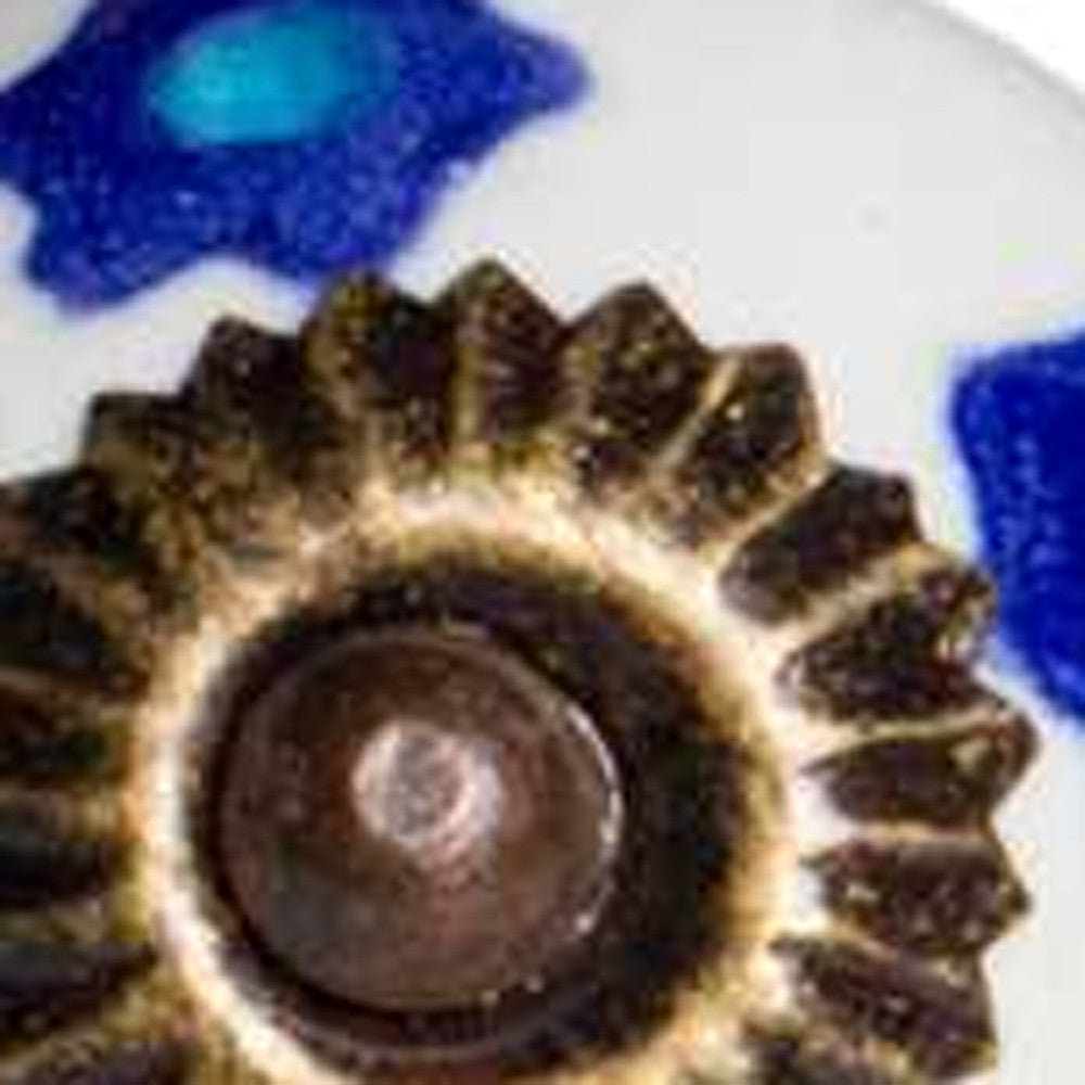 A set of 12 hand-painted ceramic knobs in white, blue, and turquoise, designed for furniture enhancement.