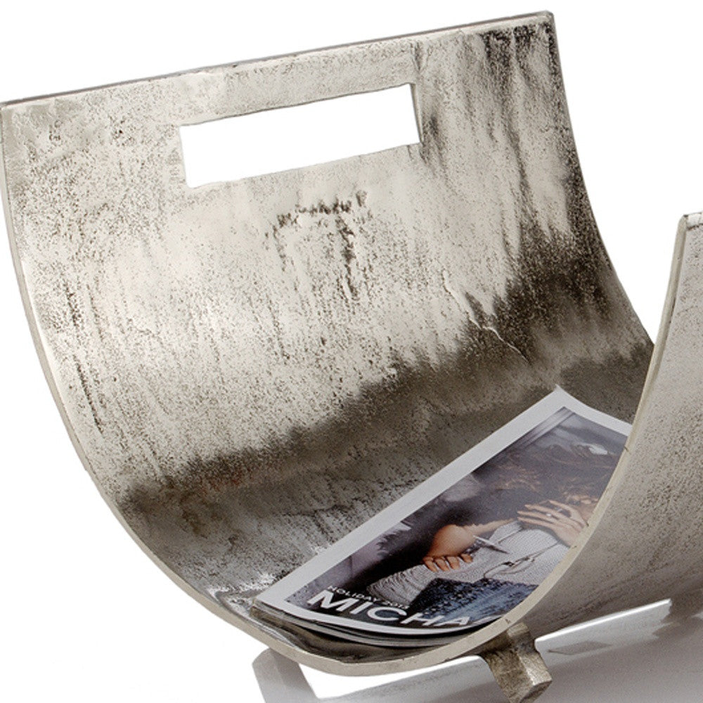 A stylish raw silver magazine basket with a modern design, perfect for organizing magazines and enhancing home decor.