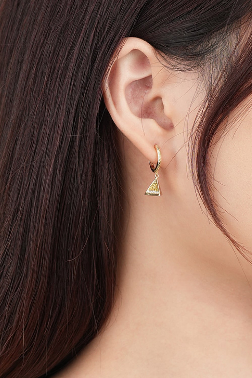 Elegant 18K gold plated cubic zirconia triangle drop earrings showcasing a modern geometric design.