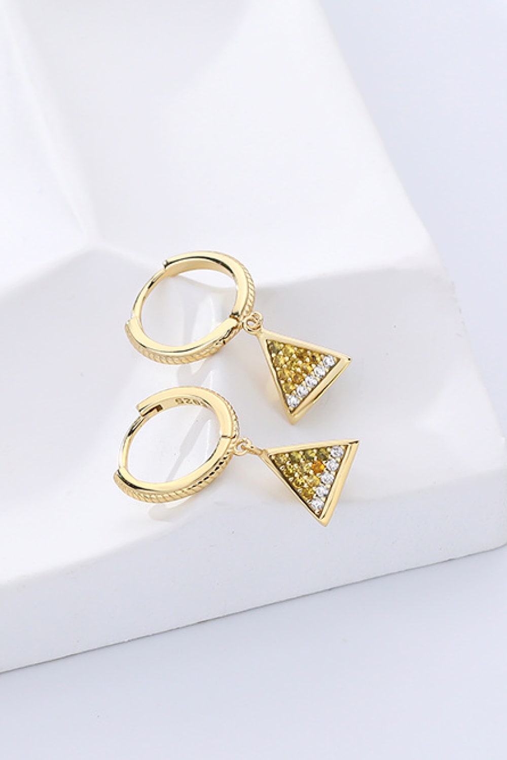 Elegant 18K gold plated cubic zirconia triangle drop earrings showcasing a modern geometric design.