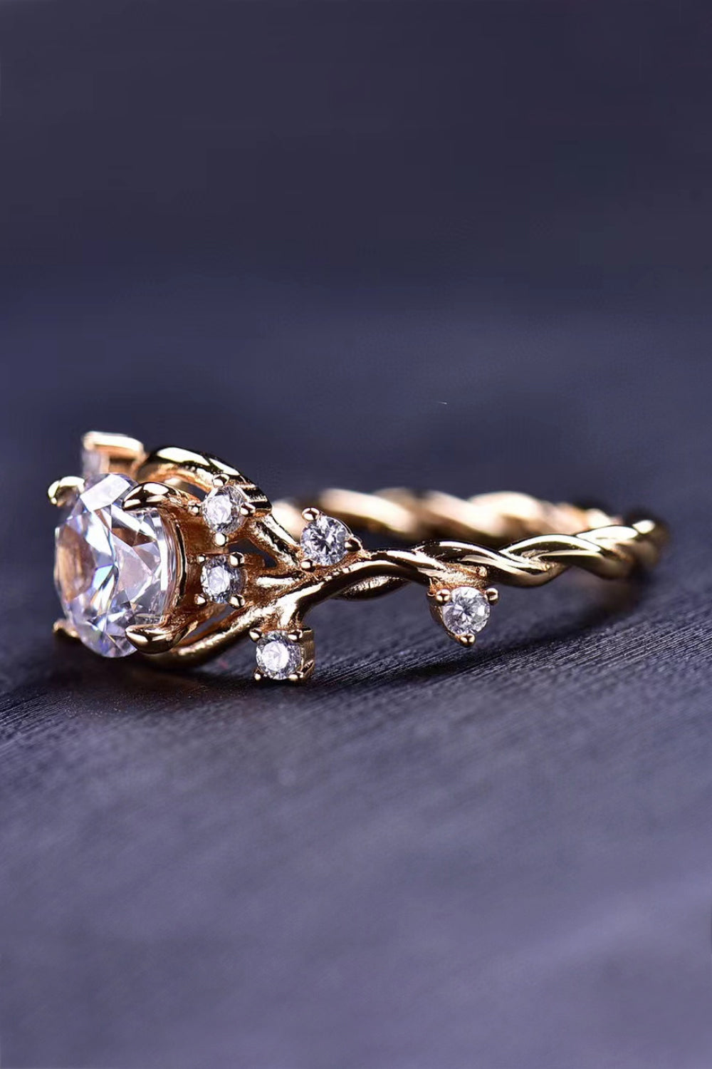 Elegant 18K Gold-Plated 1 Carat Moissanite Ring displayed in a flat lay style, showcasing its geometric design and polished finish.