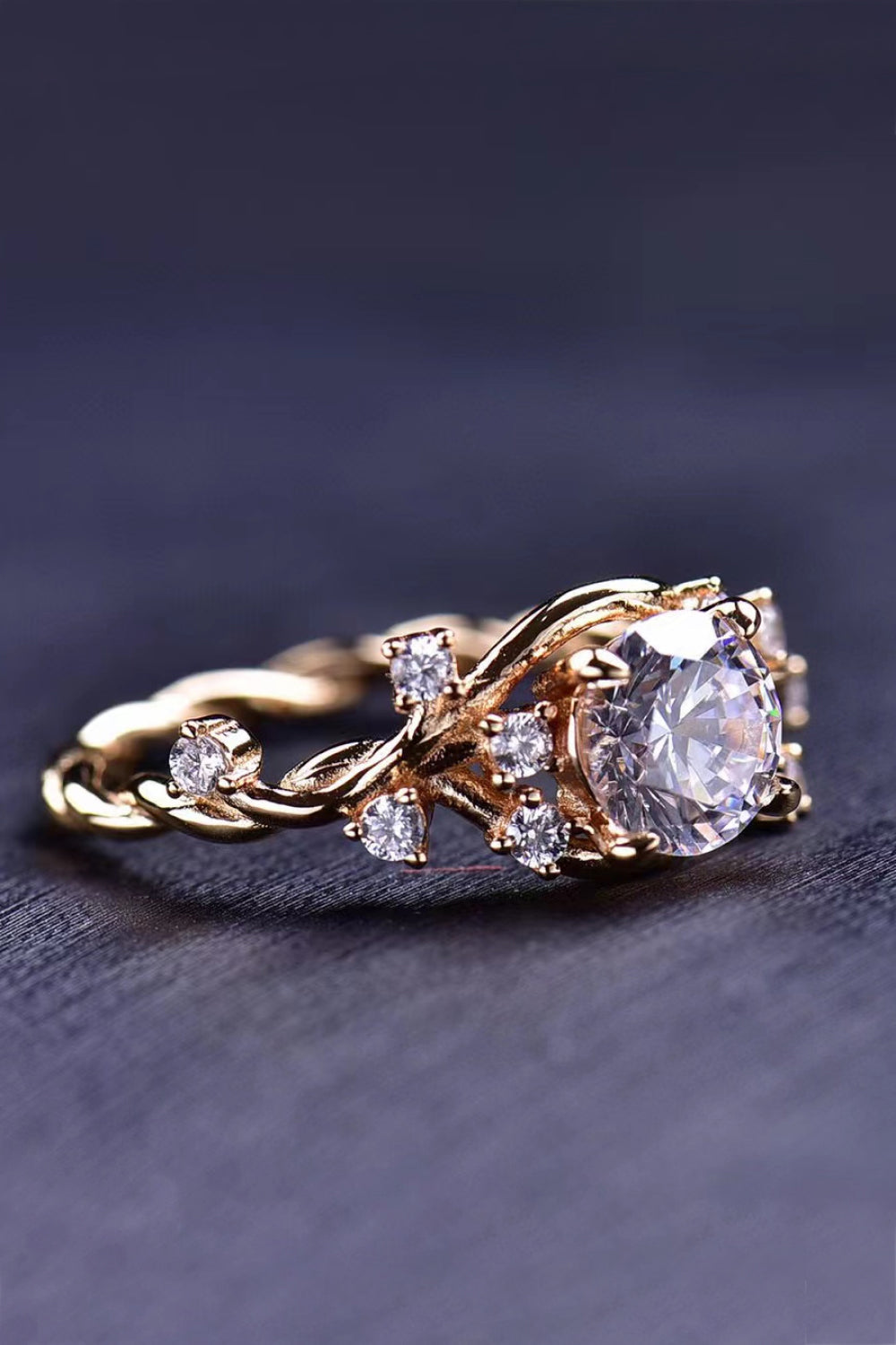 Elegant 18K Gold-Plated 1 Carat Moissanite Ring displayed in a flat lay style, showcasing its geometric design and polished finish.