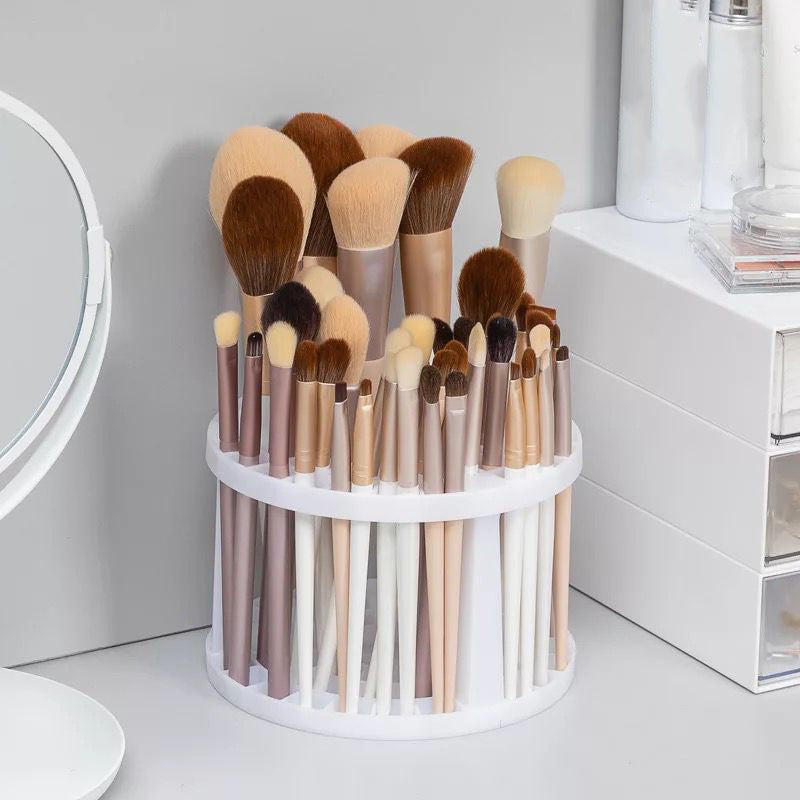 A sleek and polished plastic makeup brush storage stand, designed to hold various sizes of brushes securely and stylishly.