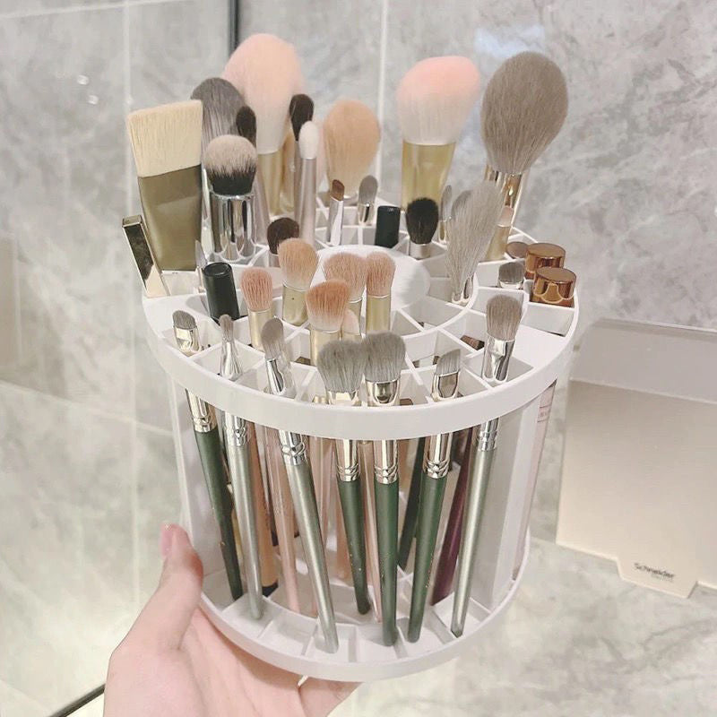 A sleek and polished plastic makeup brush storage stand, designed to hold various sizes of brushes securely and stylishly.