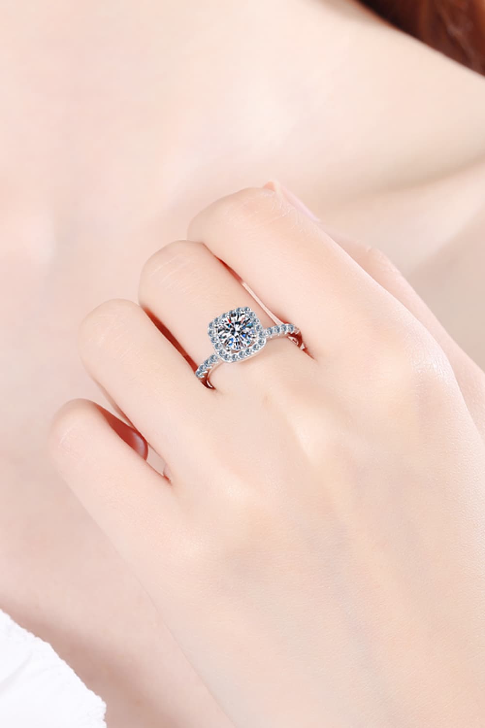 A beautiful 2 Carat Moissanite Square Halo Ring crafted in 925 sterling silver with a polished finish, featuring a central moissanite stone surrounded by zircon accents.