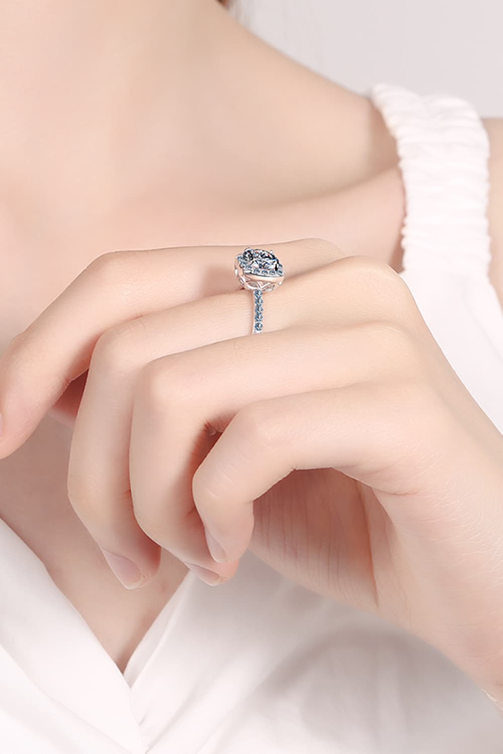 A beautiful 2 Carat Moissanite Square Halo Ring crafted in 925 sterling silver with a polished finish, featuring a central moissanite stone surrounded by zircon accents.