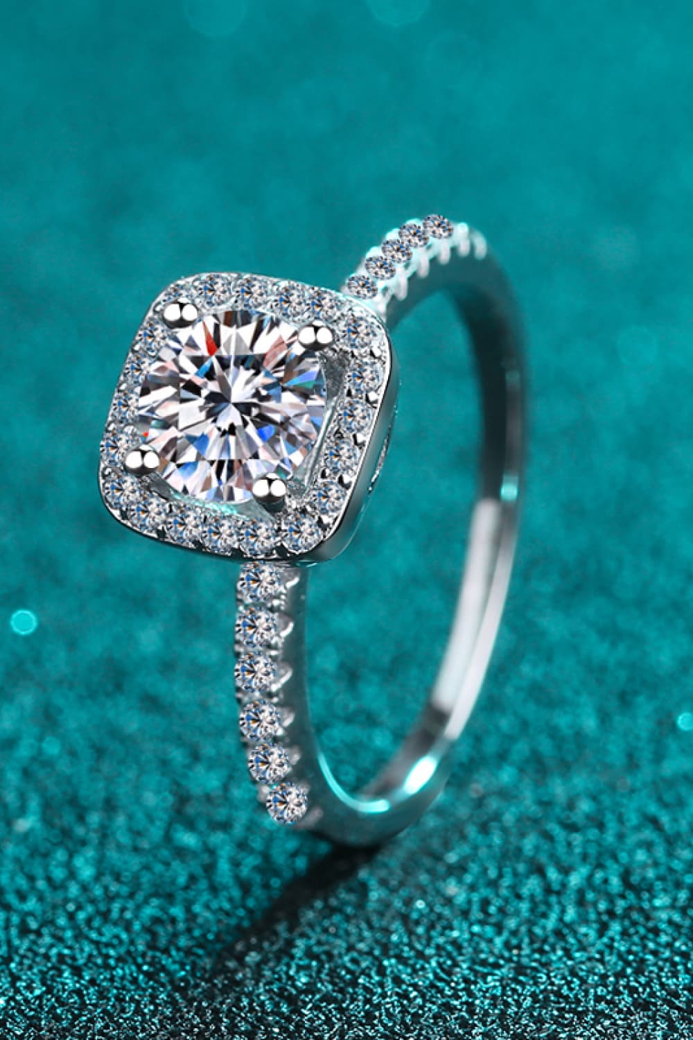 A beautiful 2 Carat Moissanite Square Halo Ring crafted in 925 sterling silver with a polished finish, featuring a central moissanite stone surrounded by zircon accents.