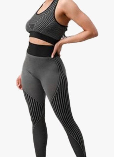 A stylish 2 piece seamless ribbed yoga outfit for women, featuring a supportive sports bra and high-waisted leggings in a vibrant color.