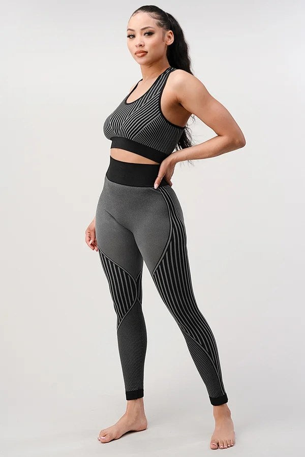 A stylish 2 piece seamless ribbed yoga outfit for women, featuring a supportive sports bra and high-waisted leggings in a vibrant color.