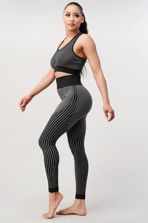 A stylish 2 piece seamless ribbed yoga outfit for women, featuring a supportive sports bra and high-waisted leggings in a vibrant color.