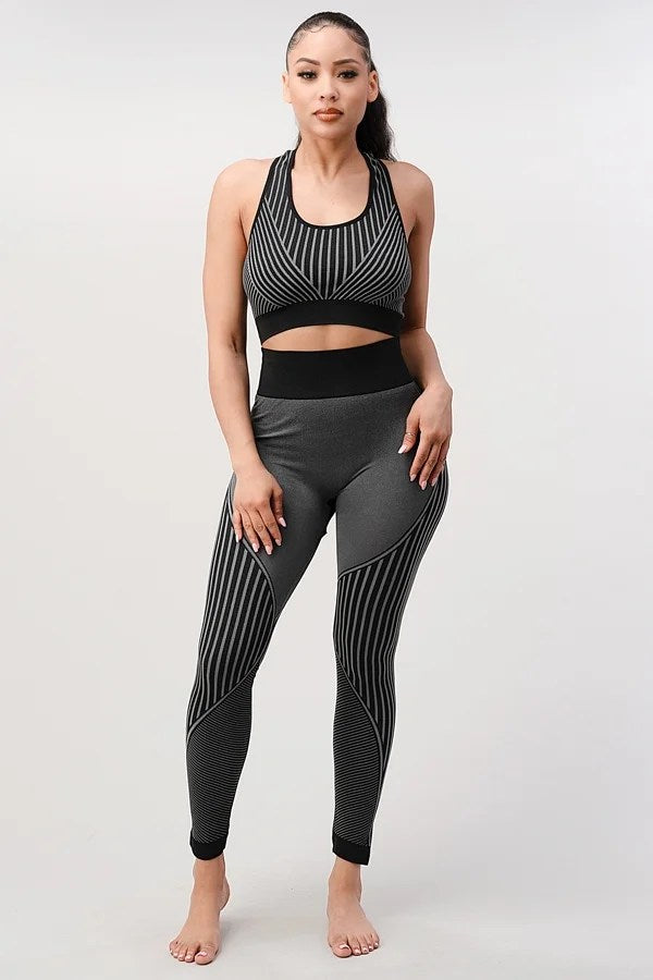 A stylish 2 piece seamless ribbed yoga outfit for women, featuring a supportive sports bra and high-waisted leggings in a vibrant color.