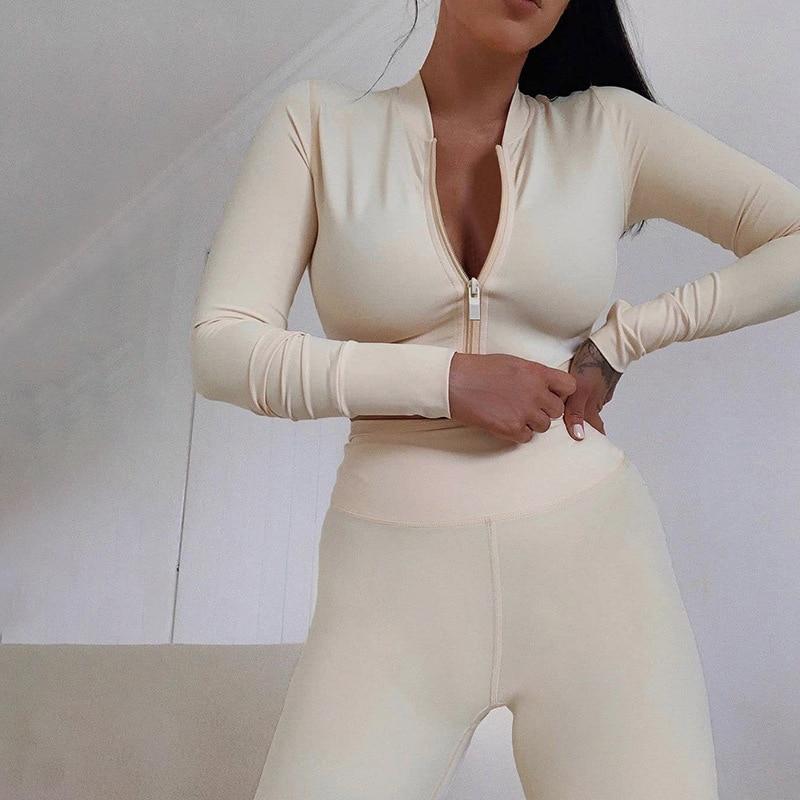 A stylish 2 Piece Set featuring a long sleeve crop top and high waist leggings in three trendy colors, perfect for winter streetwear.