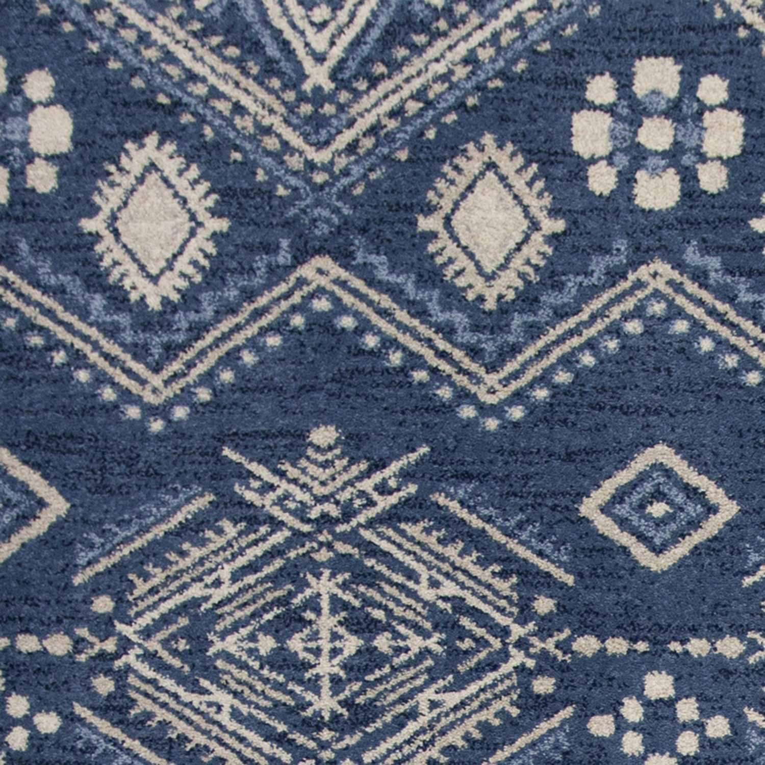 A stylish 2' x 4' Polypropylene Denim Area Rug featuring a bohemian design, perfect for enhancing home decor.