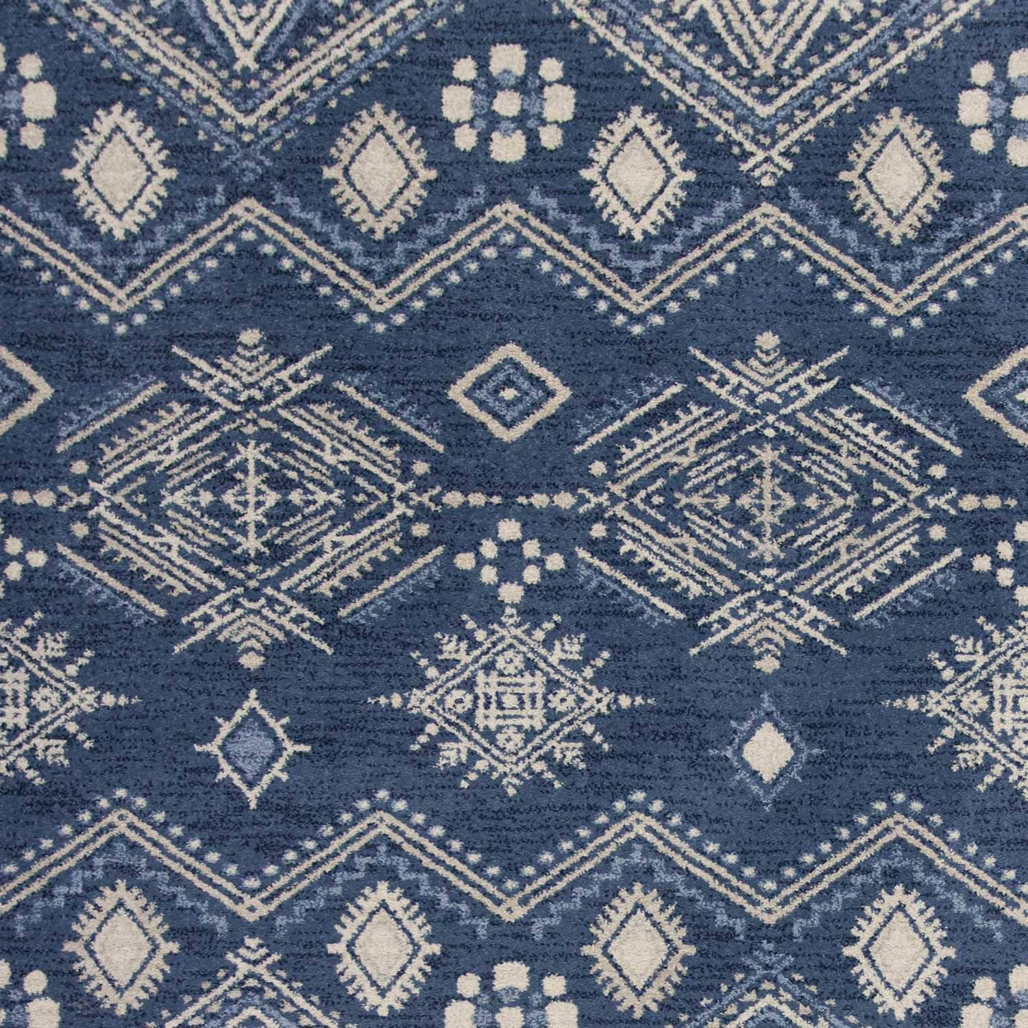 A stylish 2' x 4' Polypropylene Denim Area Rug featuring a bohemian design, perfect for enhancing home decor.