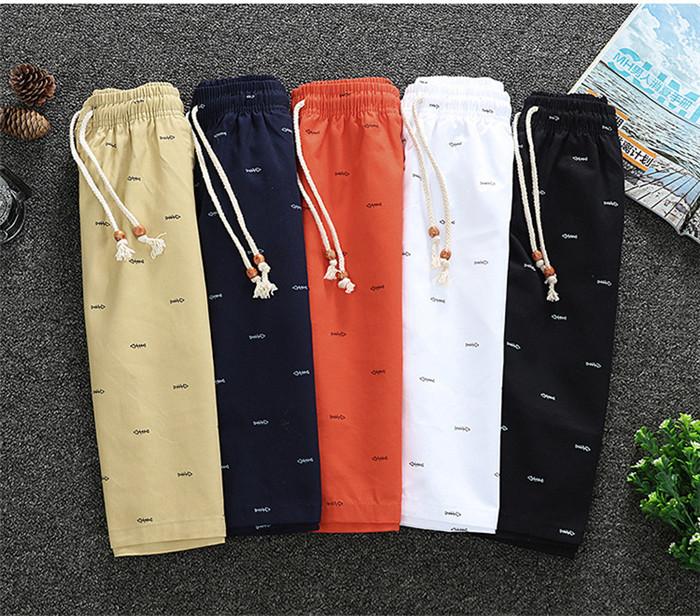 2020 Men's Casual Shorts in knee-length design, made from breathable cotton with a drawstring closure, perfect for summer activities.