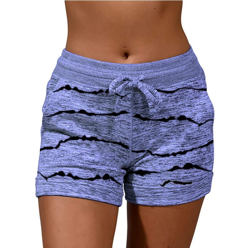 A pair of stylish women's quick-drying shorts with a striped pattern, perfect for yoga and casual sports.