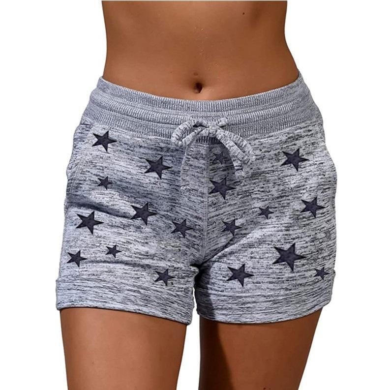 A pair of stylish women's quick-drying shorts with a striped pattern, perfect for yoga and casual sports.