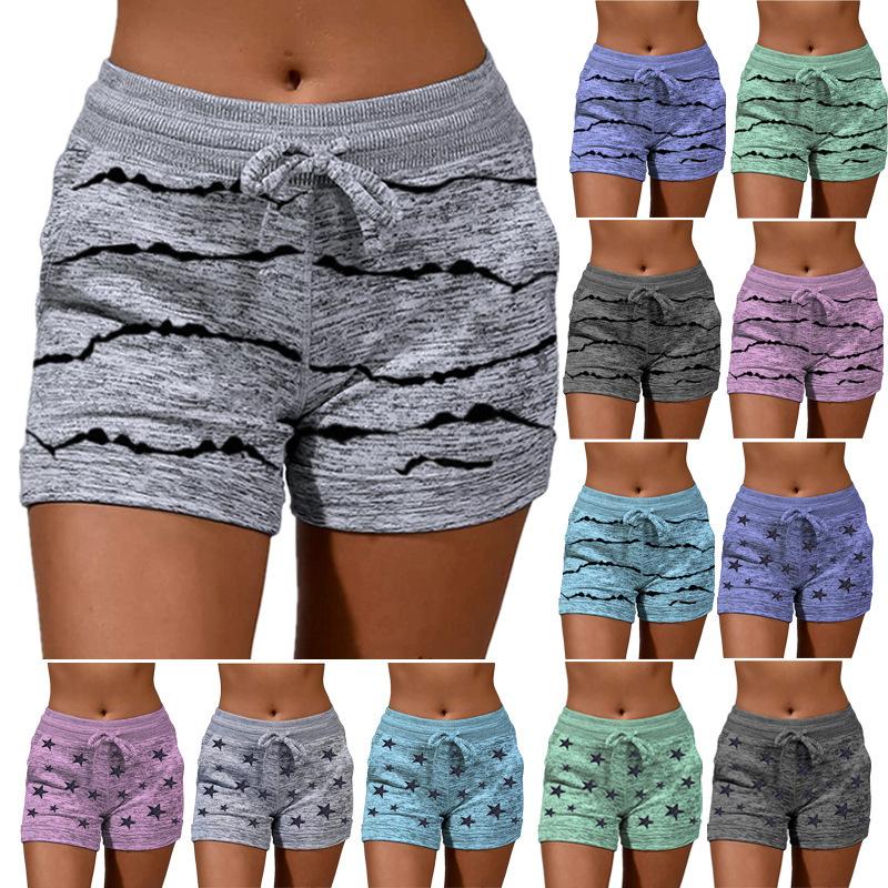 A pair of stylish women's quick-drying shorts with a striped pattern, perfect for yoga and casual sports.