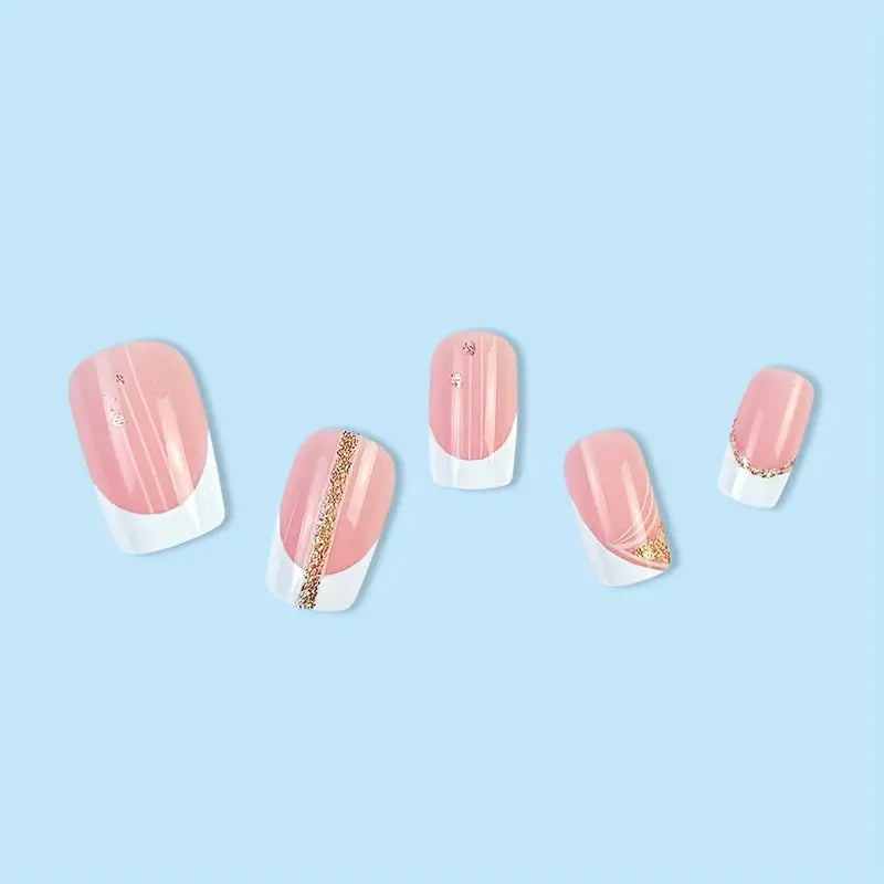 A set of 24 short squoval French tip press-on nails with a glossy finish and glitter accents, displayed elegantly in a stylish packaging.