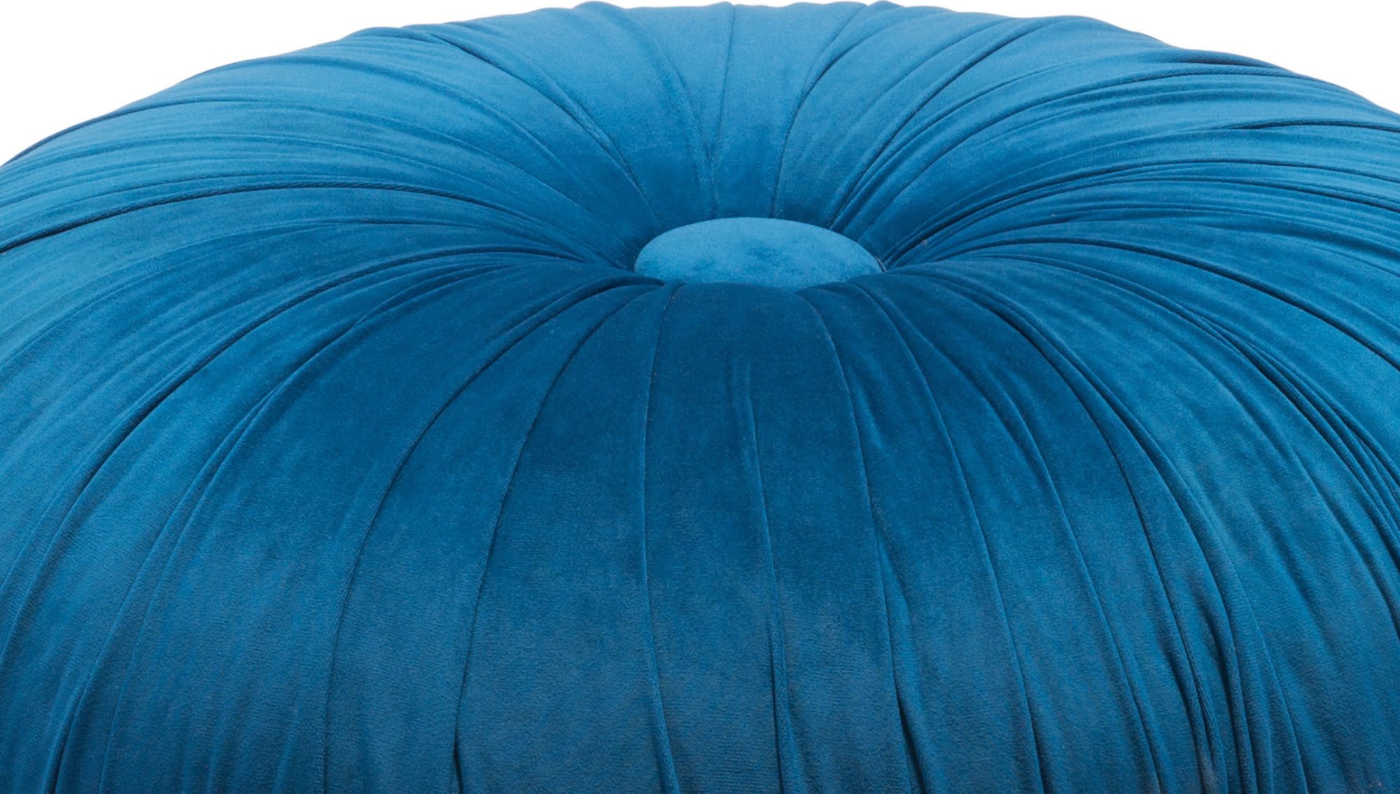 A stylish blue velvet ottoman with a round wooden base and button tuft design, perfect for seating or decoration.