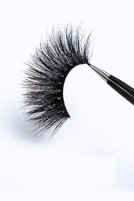 A pair of 25mm dramatic volume mink eyelashes displayed in elegant packaging, showcasing their fluffy texture and round eye shape.