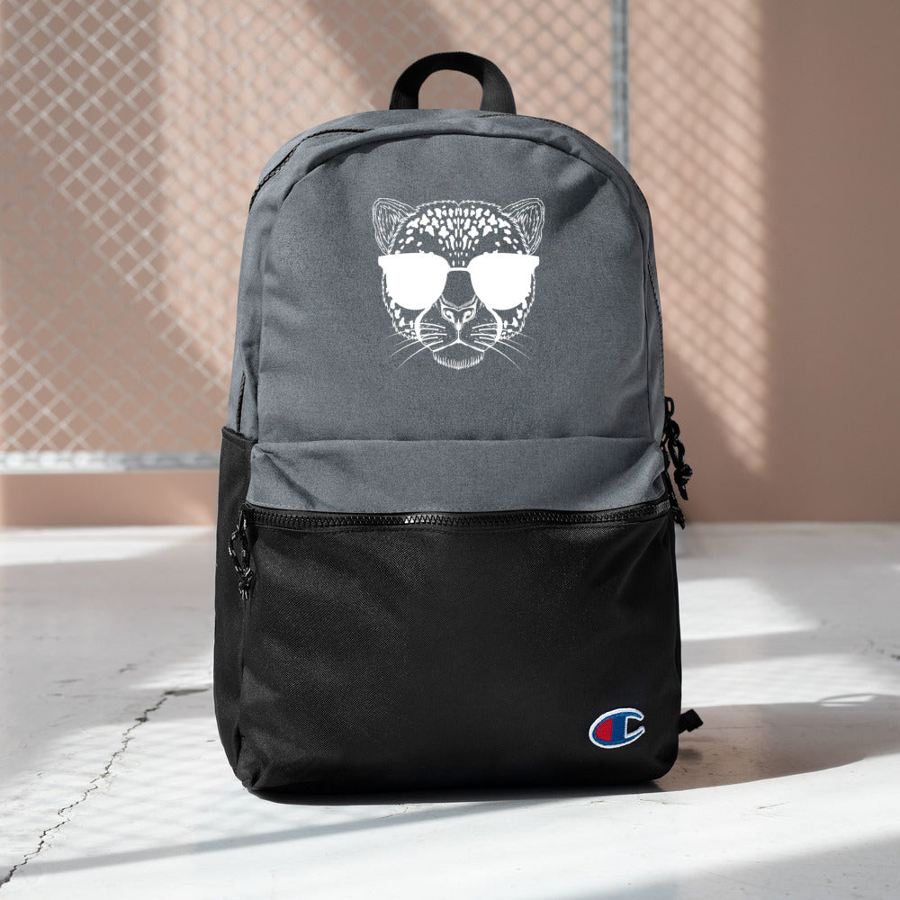 2882Sport™ Tropics Of OZ Champion backpack featuring an embroidered tiger design, water-resistant fabric, and padded ergonomic straps.