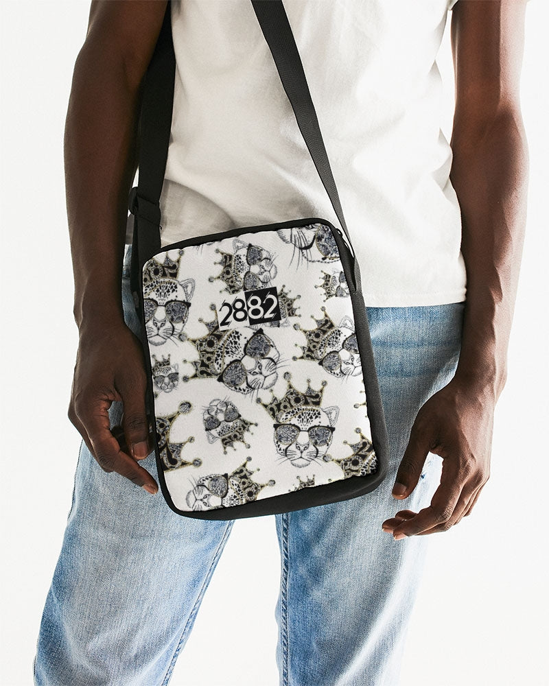 2882Sport™ Tropics Of OZ Messenger Pouch featuring a vibrant lion design, waterproof exterior, and adjustable strap.