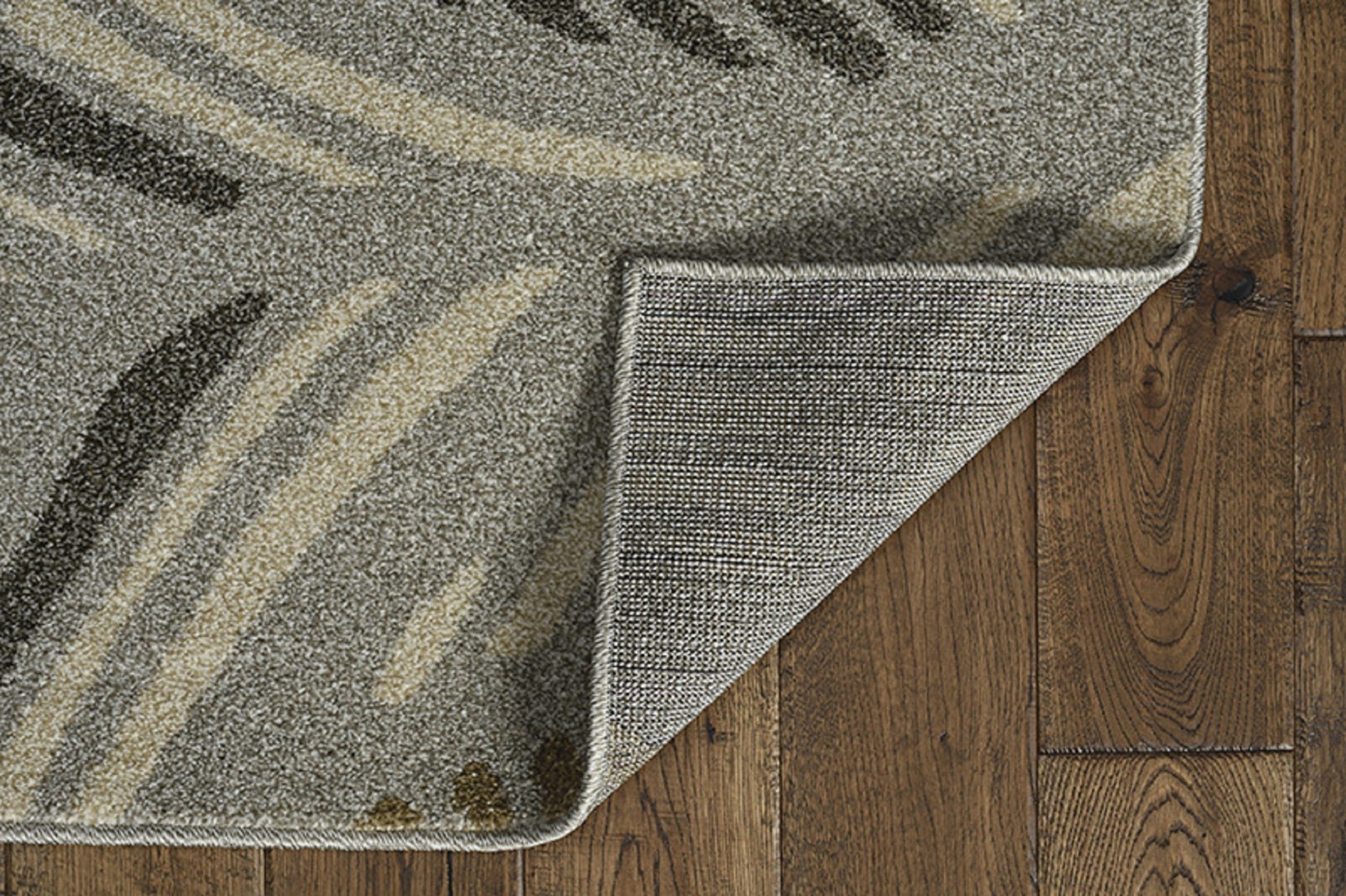 A stylish 2x3 grey and beige waves accent rug, showcasing elegant patterns suitable for indoor and outdoor use.