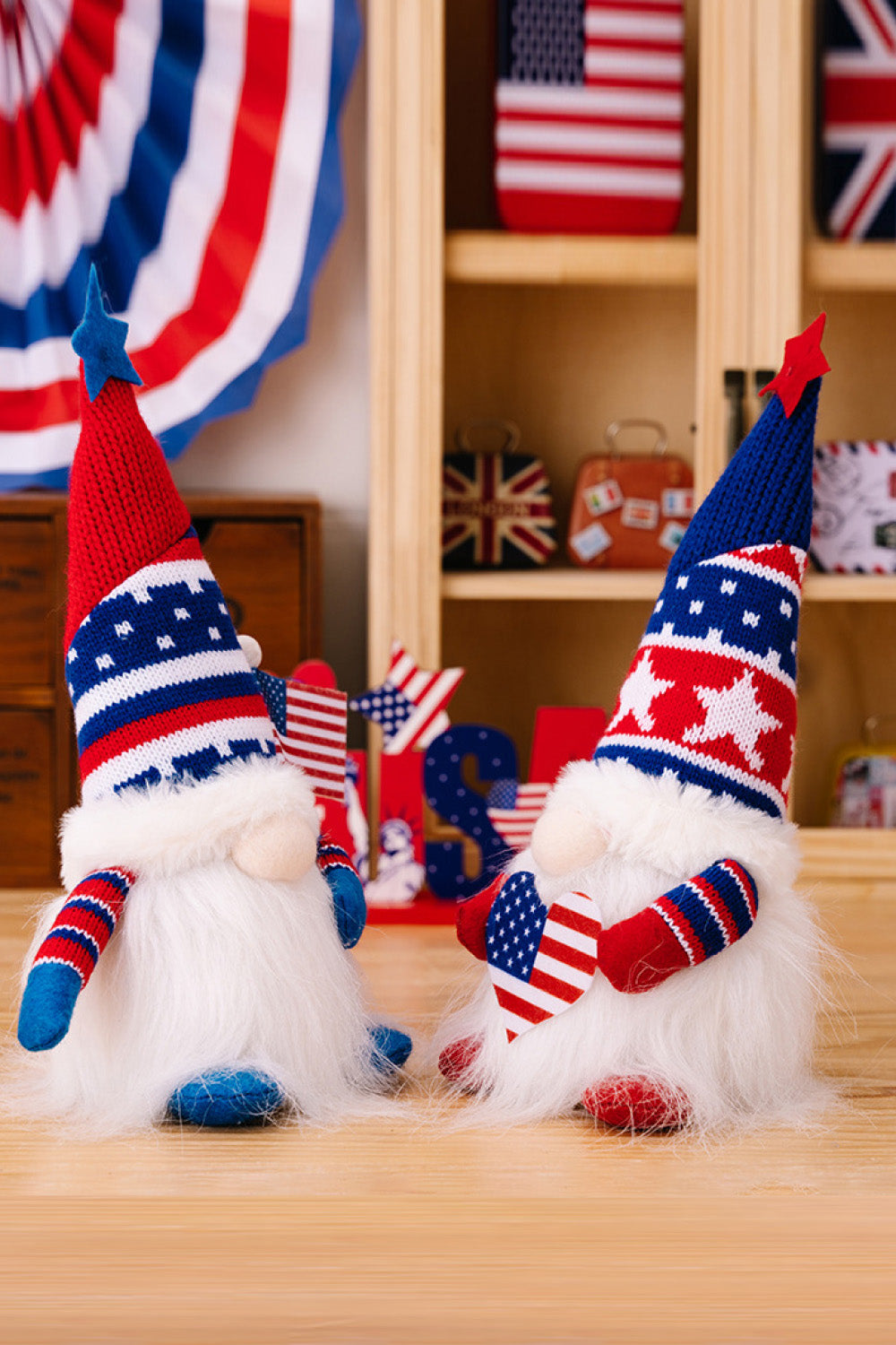 Two charming Independence Day gnomes made of knit fabric, featuring festive colors and designs, perfect for holiday decor.