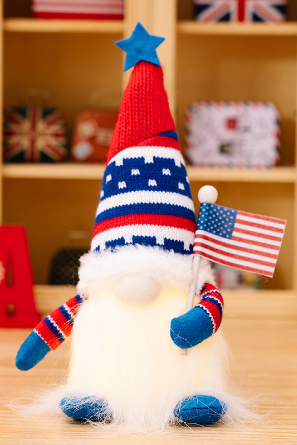 Two charming Independence Day gnomes made of knit fabric, featuring festive colors and designs, perfect for holiday decor.