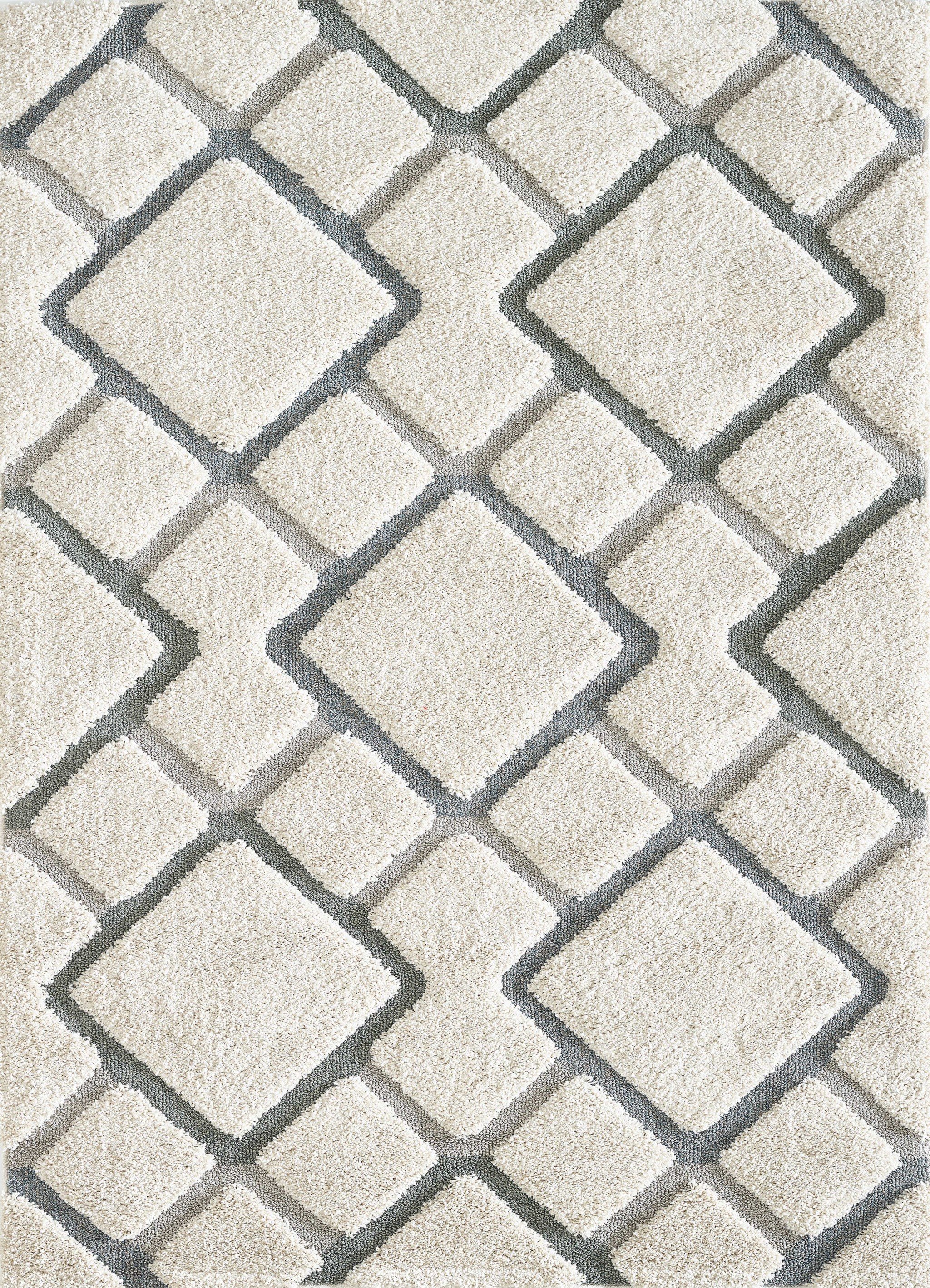 A stylish 3' x 5' Polypropylene Natural Area Rug featuring a plush hi-lo pile, perfect for enhancing modern home decor.