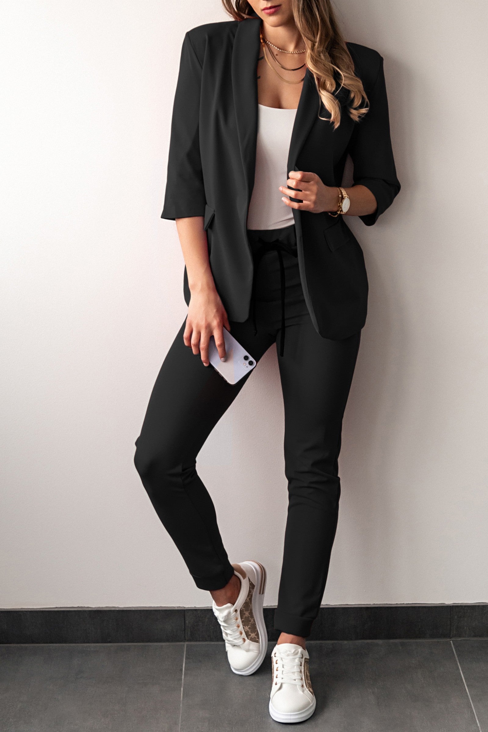 Elegant black 3/4 sleeve blazer and fitted pants set, showcasing a classic collar and drawstring waist.