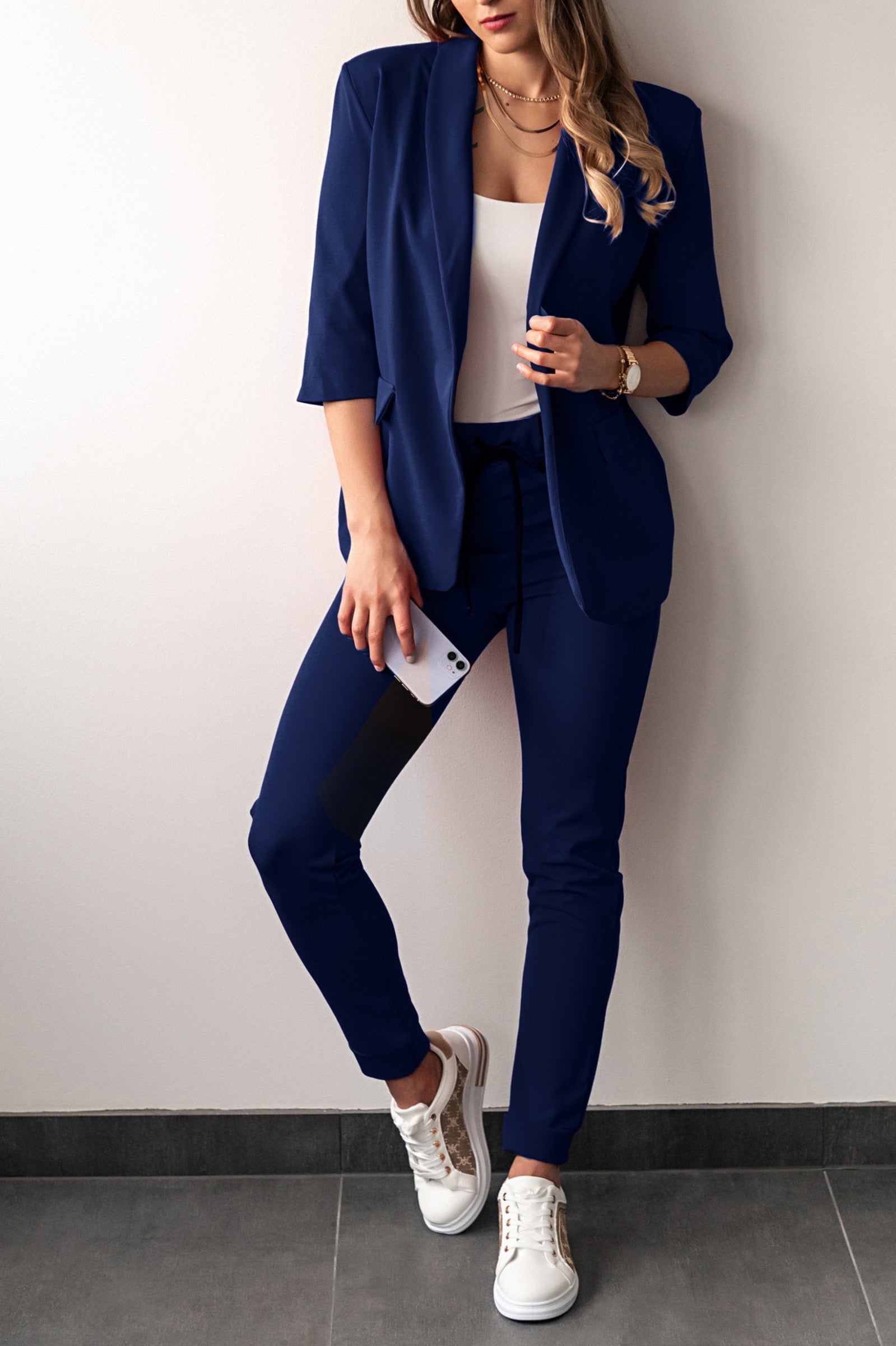 Dark blue 3/4 sleeve blazer and fitted pants set, showcasing elegant design and high-quality fabric.