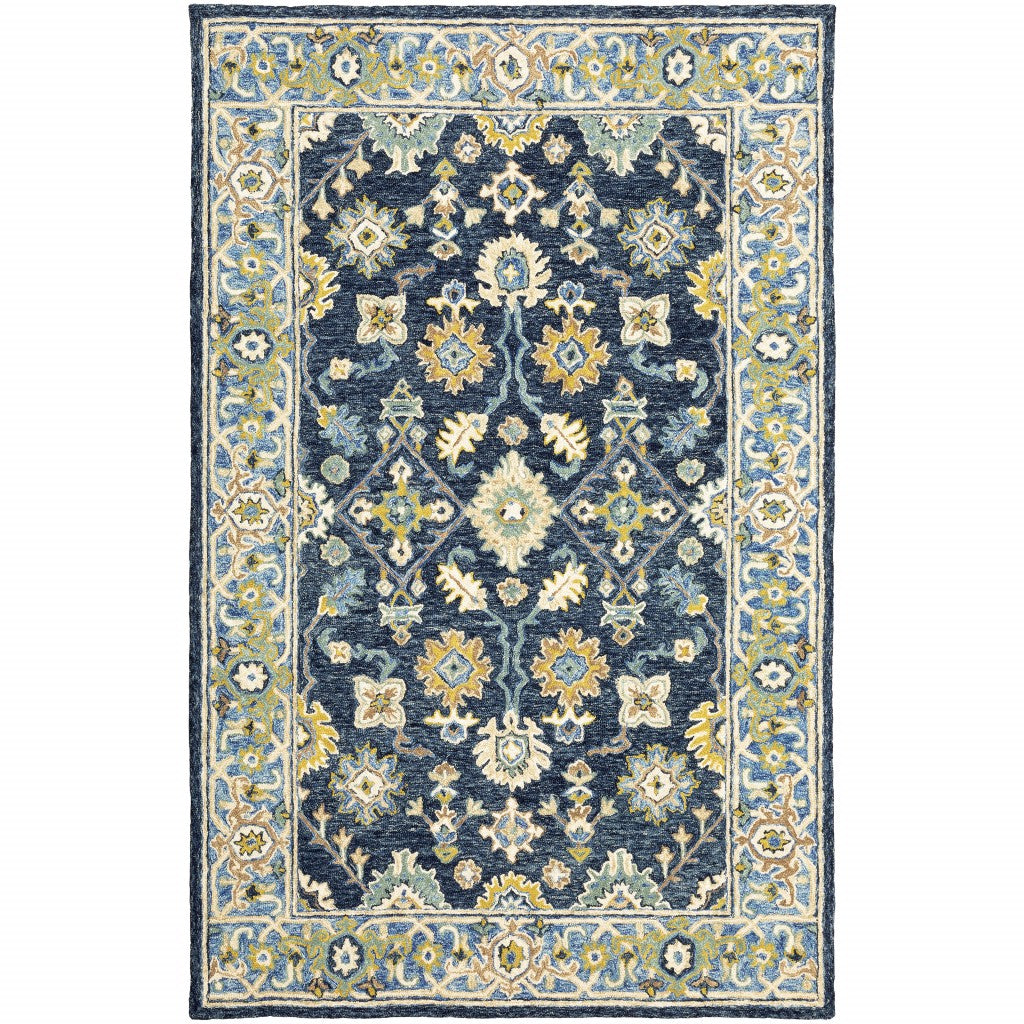 Navy and blue bohemian area rug with floral motifs on a muted navy backdrop, showcasing vibrant colors and luxurious wool texture.