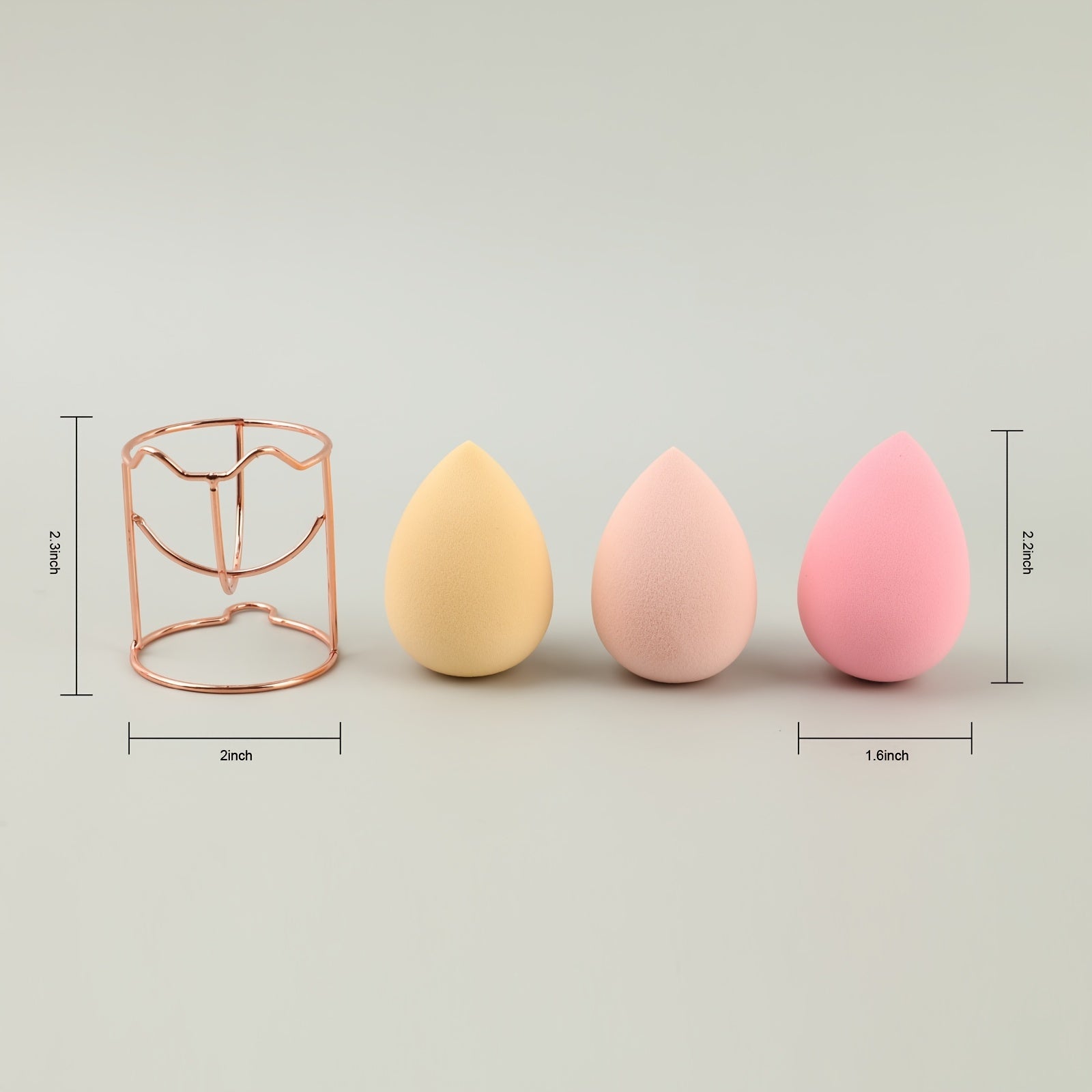 A set of four beauty blenders in various shapes and colors, designed for flawless makeup application.