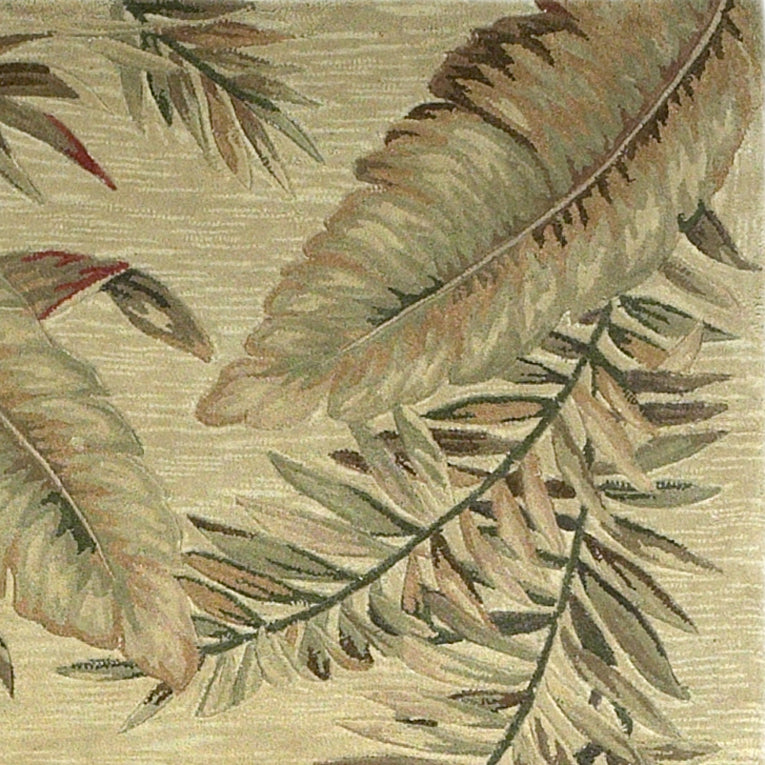 Ivory hand-tufted indoor area rug featuring tropical leaves design, showcasing intricate patterns and a vintage finish.