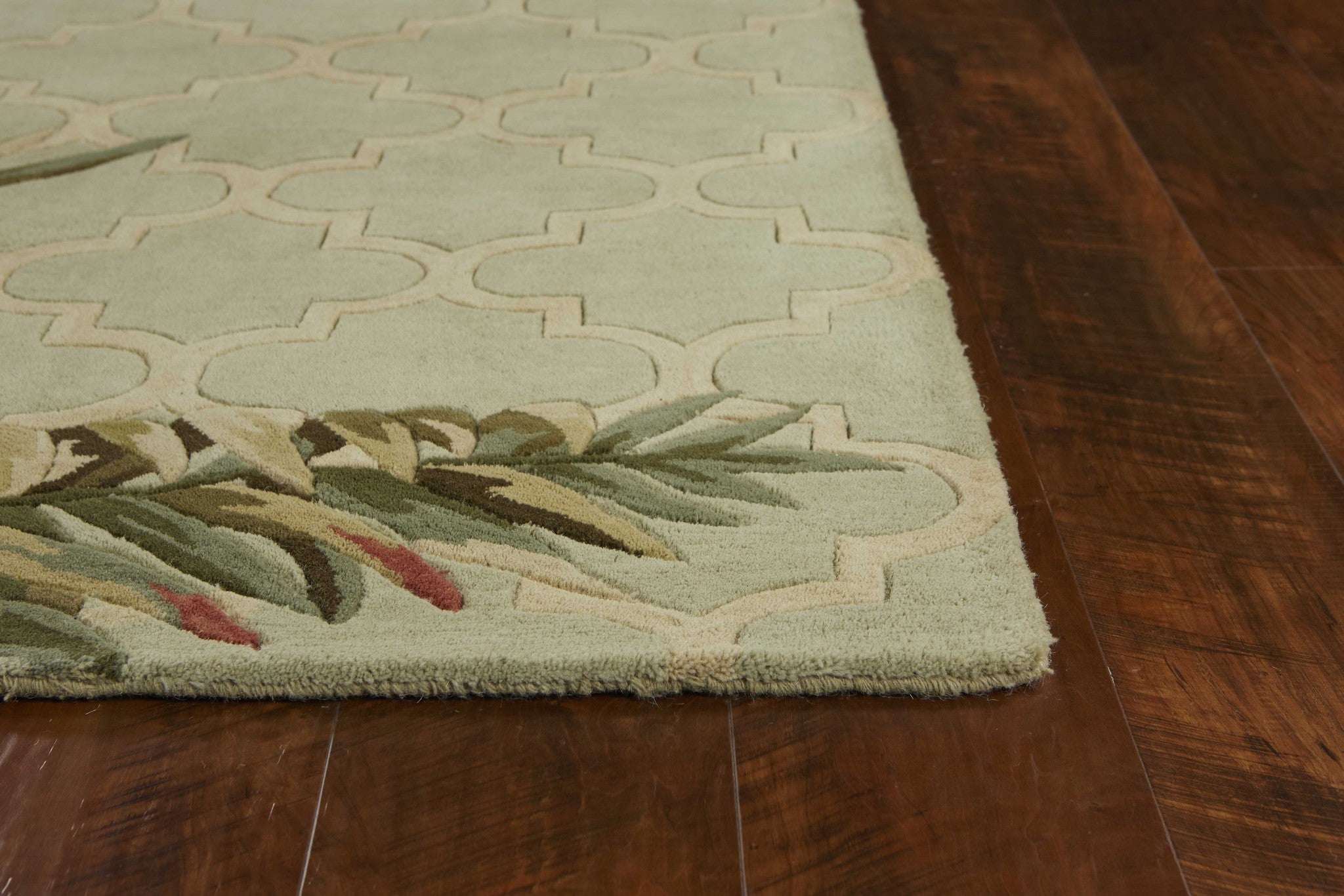 Sage green hand-tufted tropical quatrefoil indoor area rug, showcasing elegant design and soft texture.