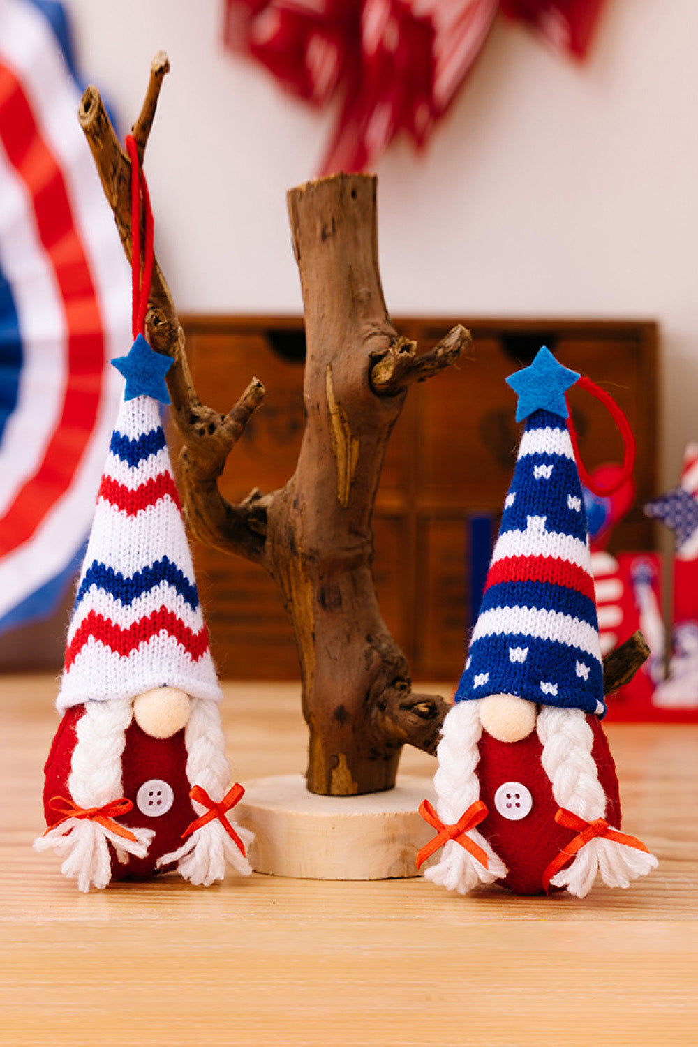 Four colorful Independence Day knit hanging gnomes, each with unique designs, perfect for festive decor.