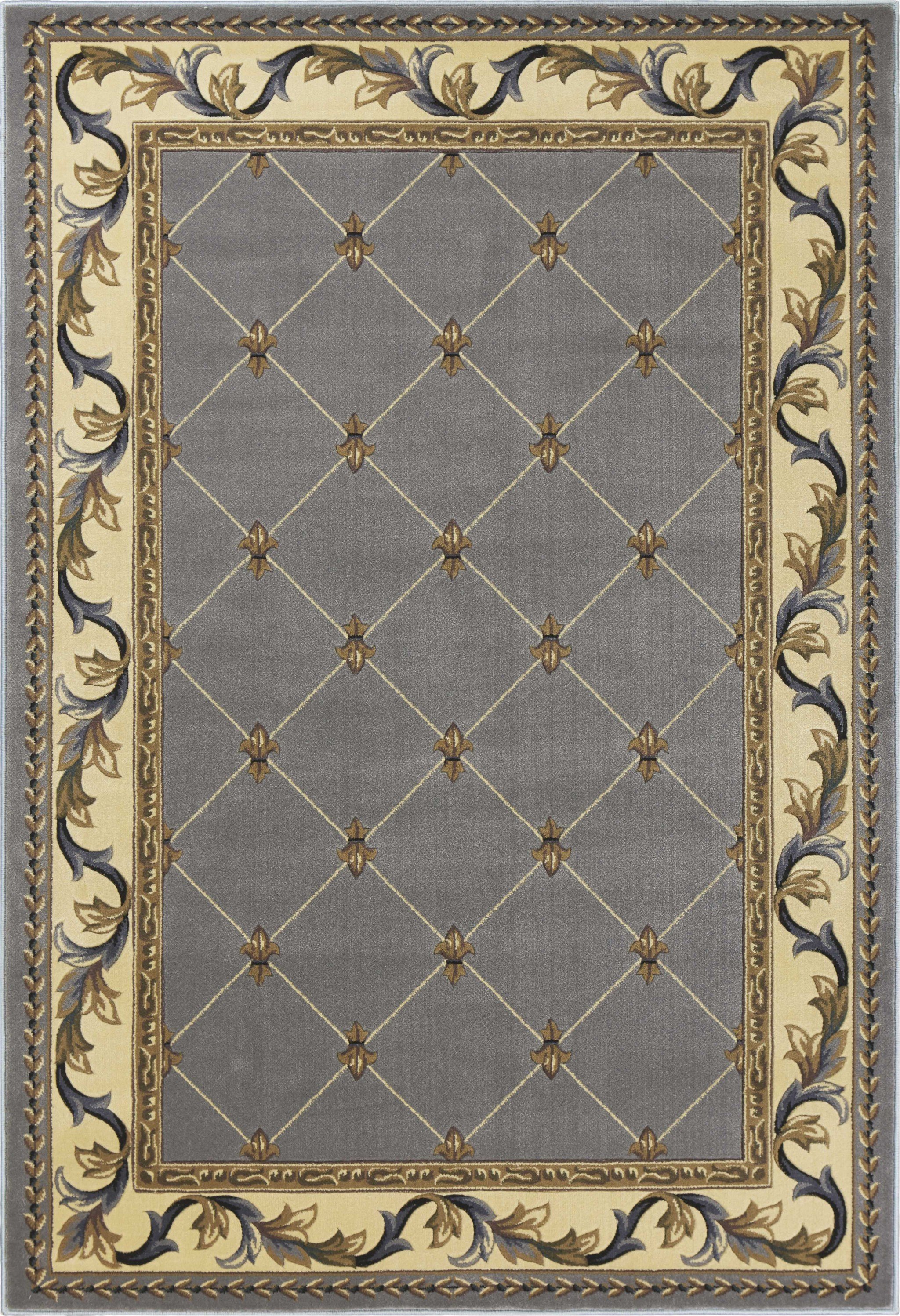 5' x 7' slate blue polypropylene area rug with fleur-de-lis pattern, showcasing intricate hand-carved details.