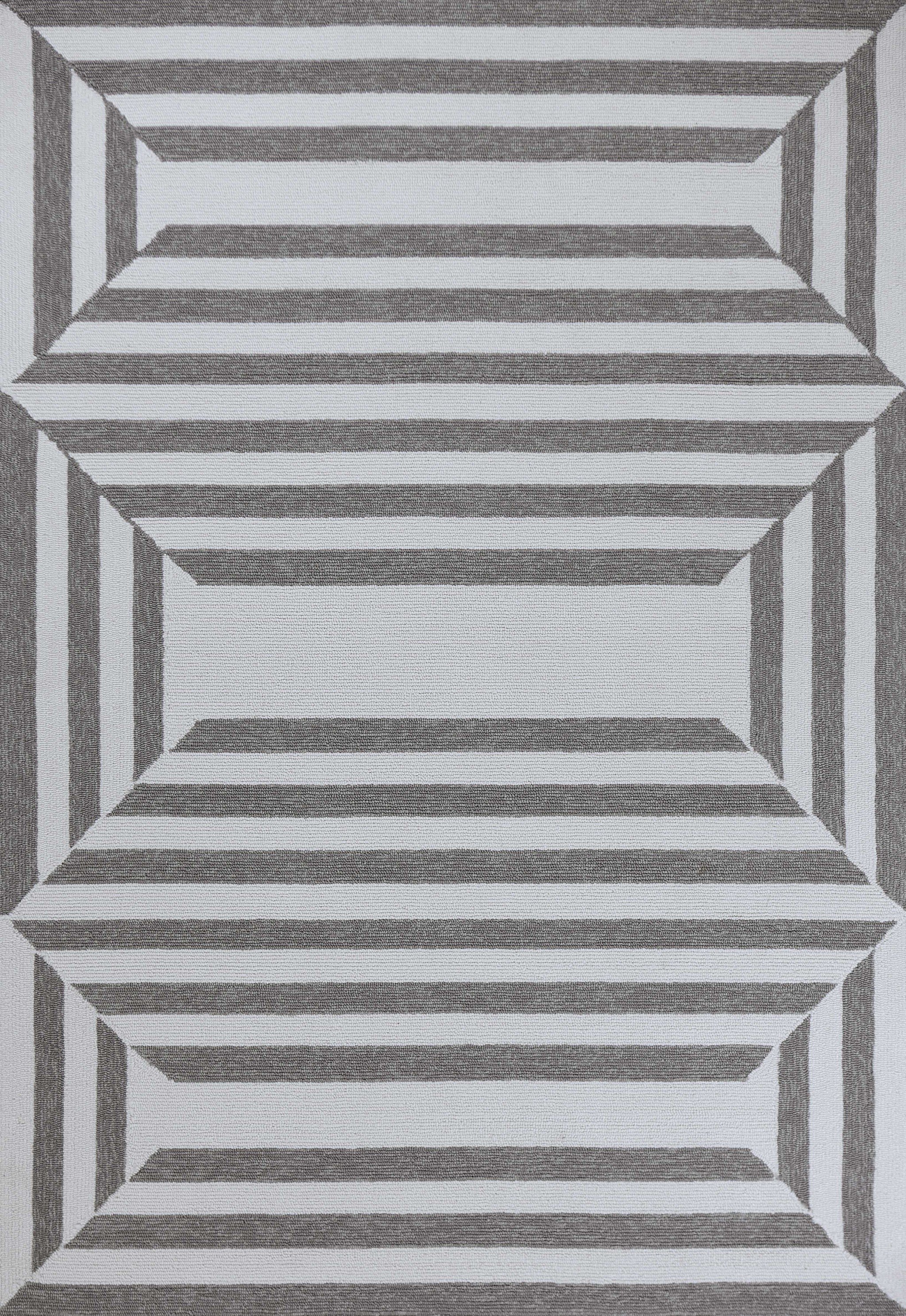 A 6' x 9' oatmeal area rug made of UV-treated polypropylene, showcasing a hand-hooked design suitable for indoor and outdoor use.