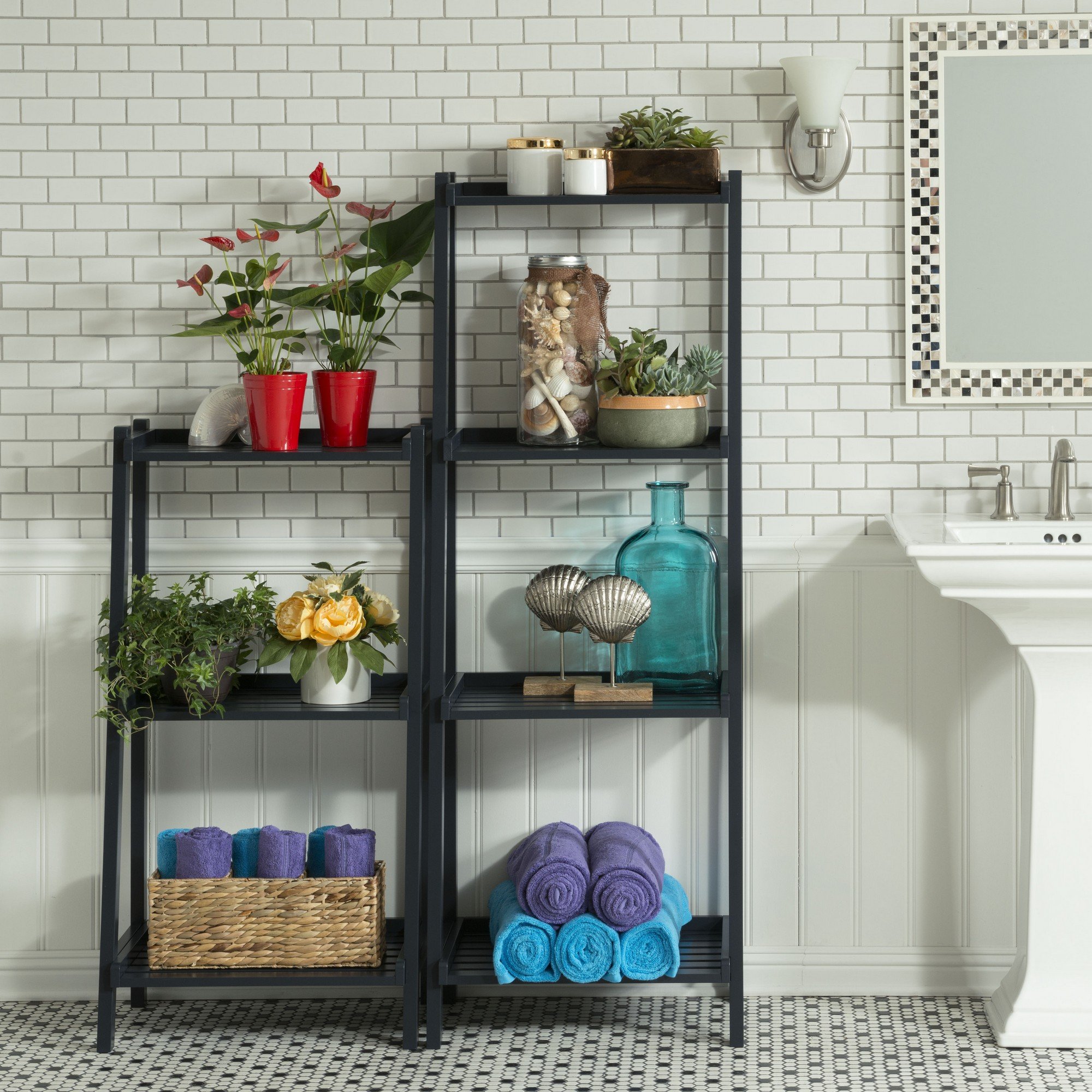 A modern 60-inch bookcase with four shelves in a sleek graphite finish, showcasing books and decorative items.