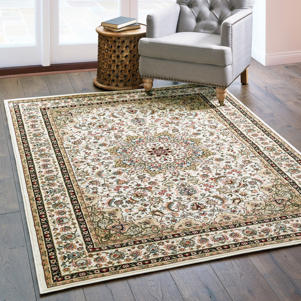 6 inches x 9 inches ivory beige machine woven oriental indoor area rug featuring intricate Persian-inspired patterns and floral medallion design.