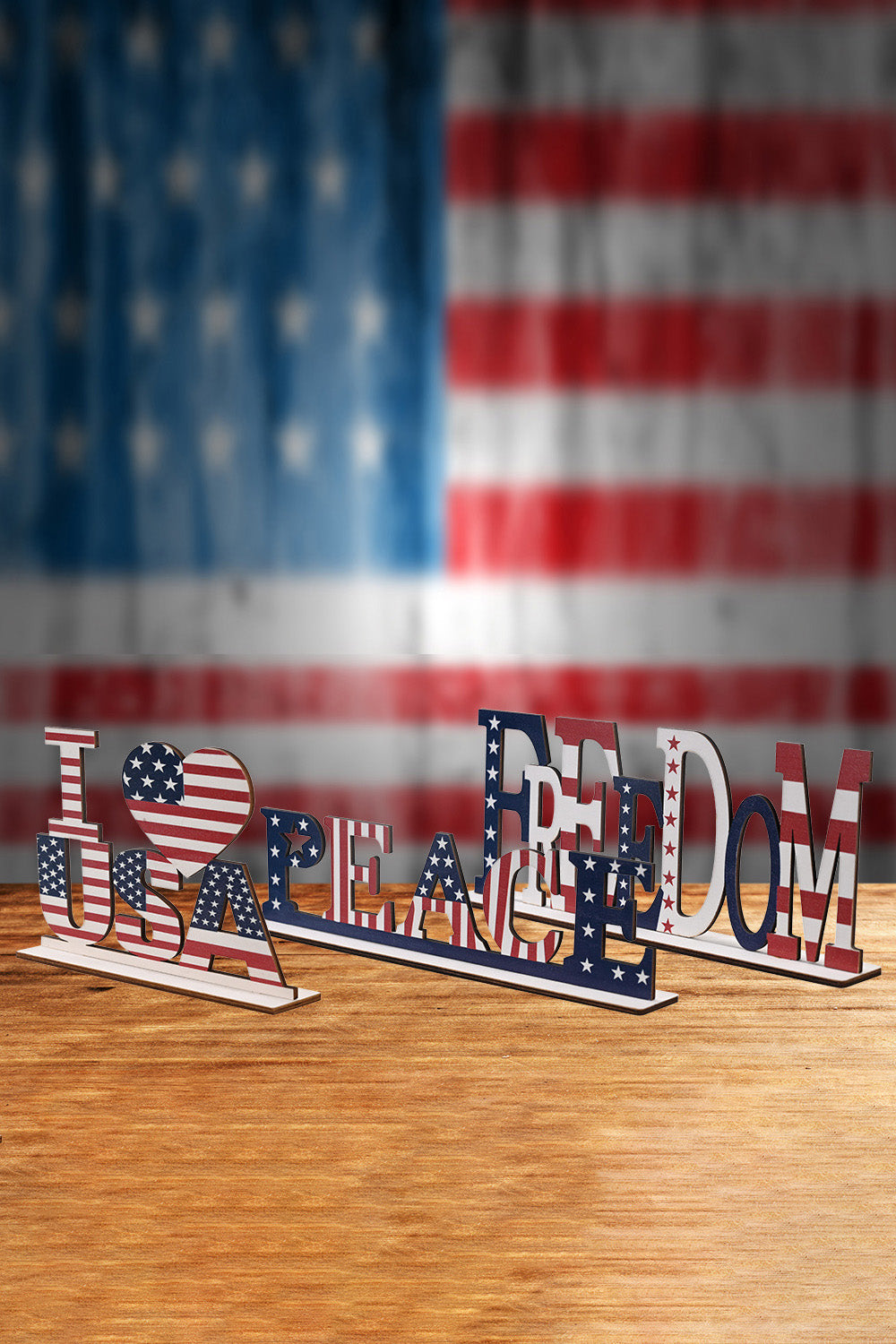 A vibrant set of 7-piece Independence Day letter decor ornaments made from knit fabric, showcasing red, white, and blue colors.